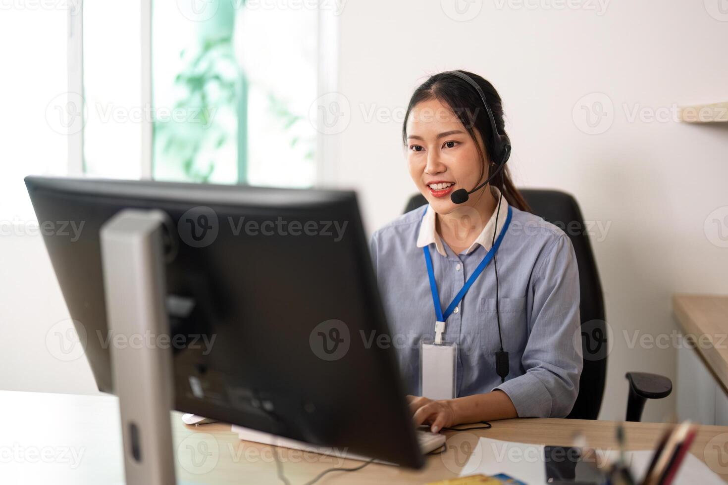 Remote Work and Customer Support. Professional woman with headset engaging in virtual communication. photo