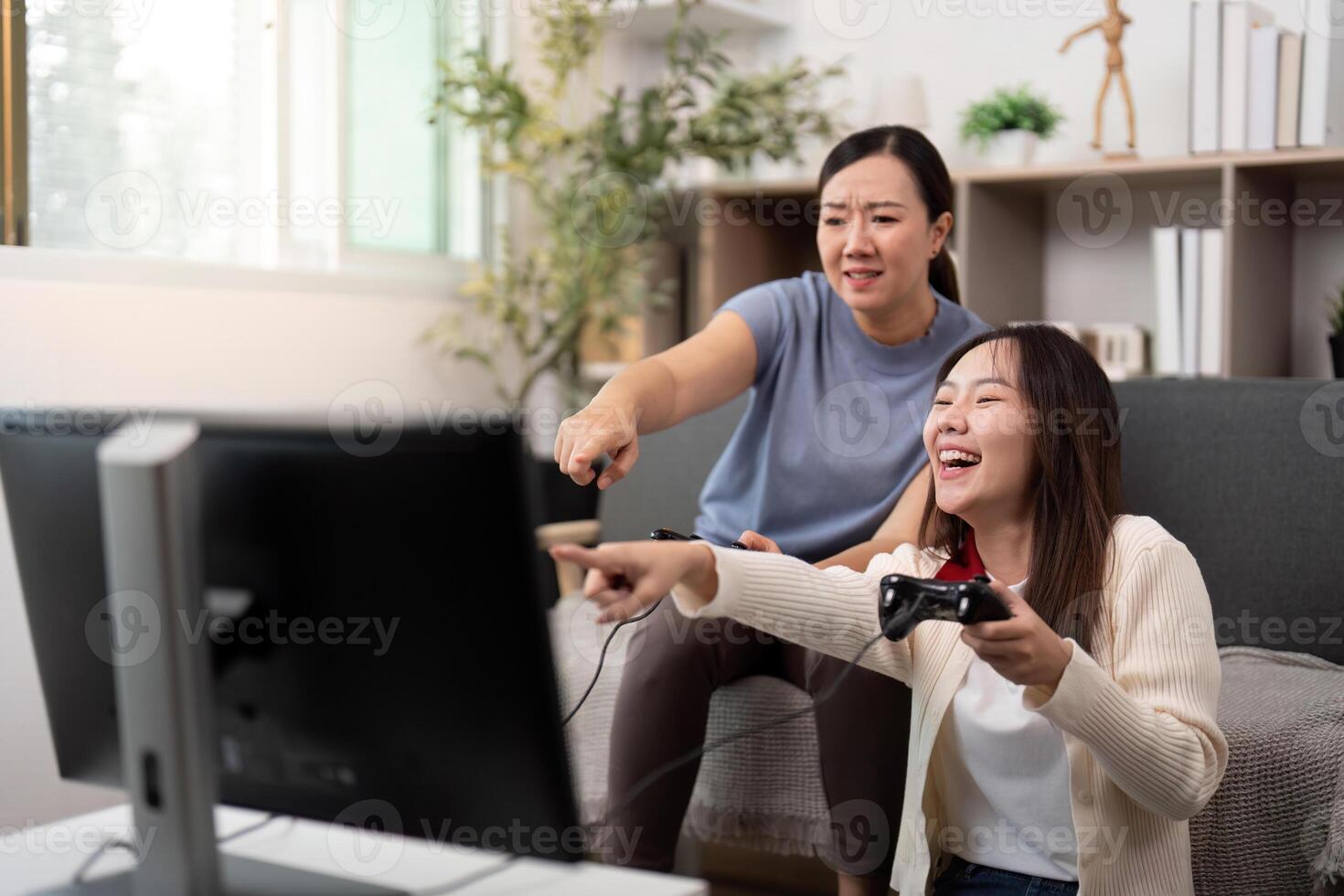 Mother and Daughter Playing Games Together. A Fun and Engaging Family Activity. photo