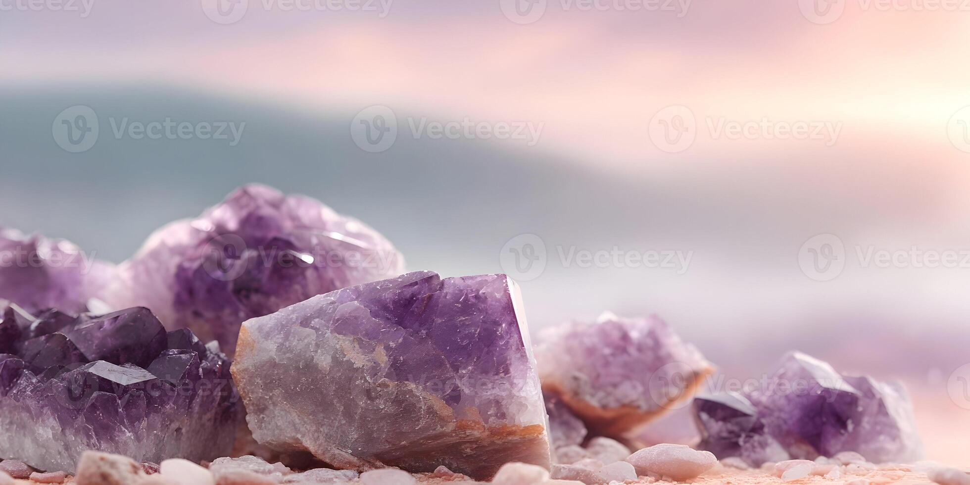 Amethyst Crystal Cluster on Beach Sand Soft Pink Sunset Background photo