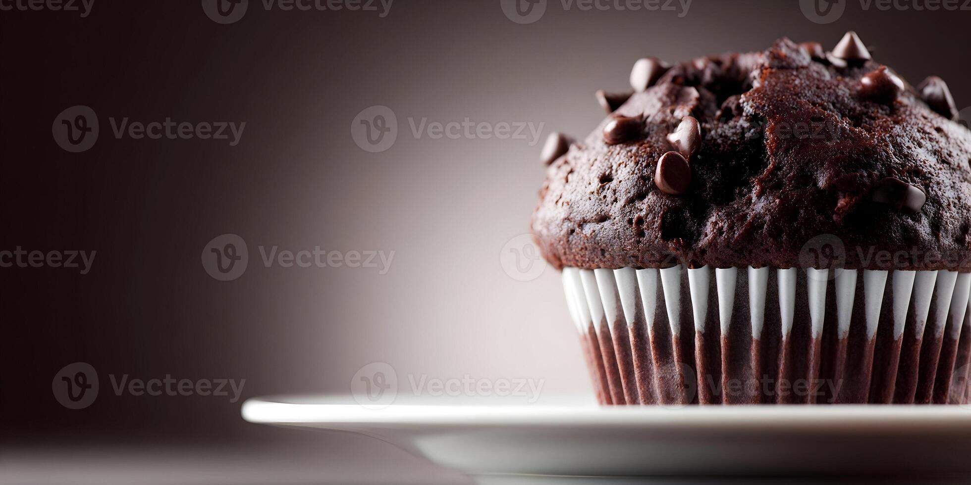 Delicious Chocolate Chip Muffin on White Plate Brown Background photo