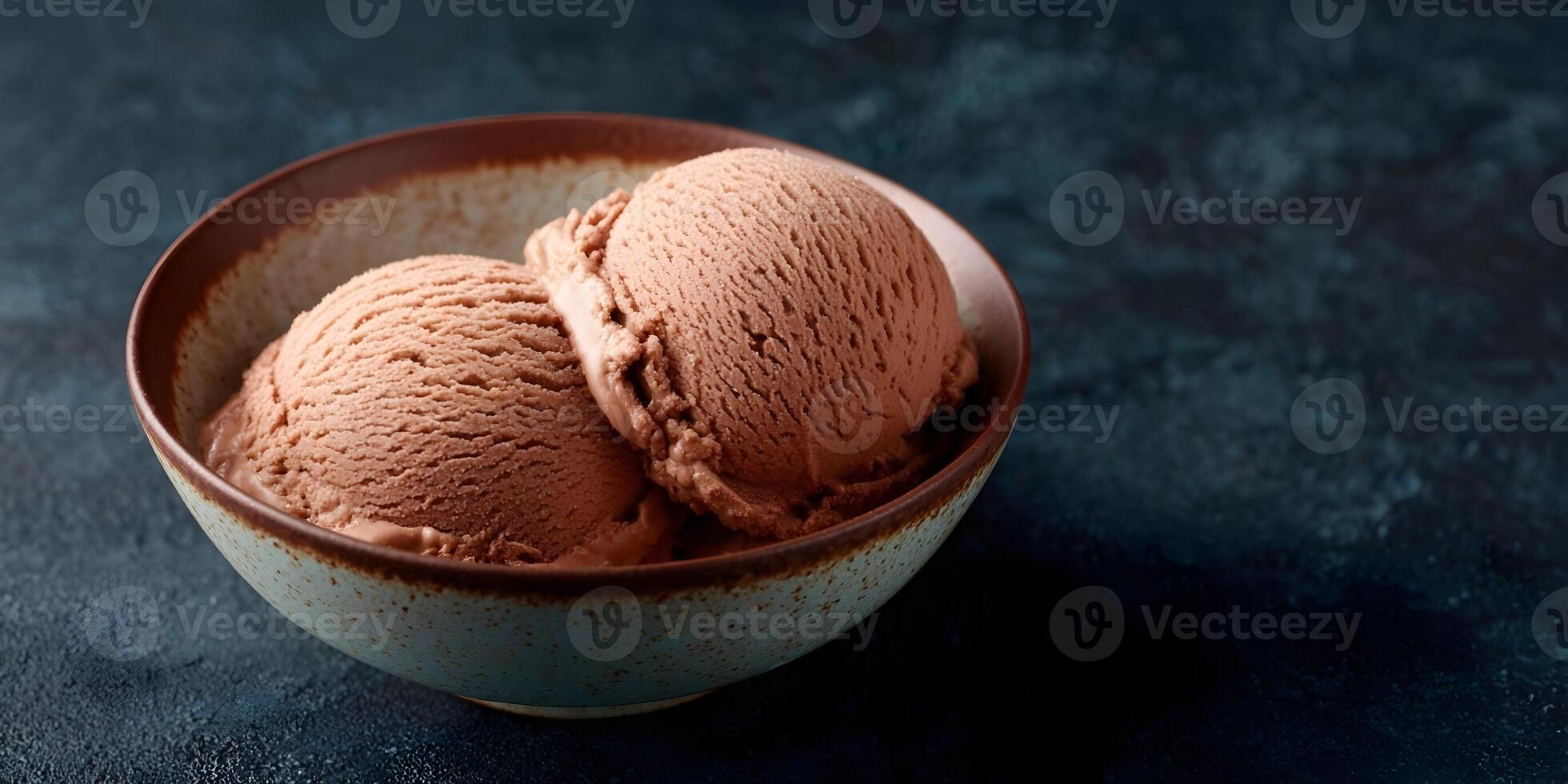 Two Scoops Chocolate Ice Cream in Bowl Dark Background photo