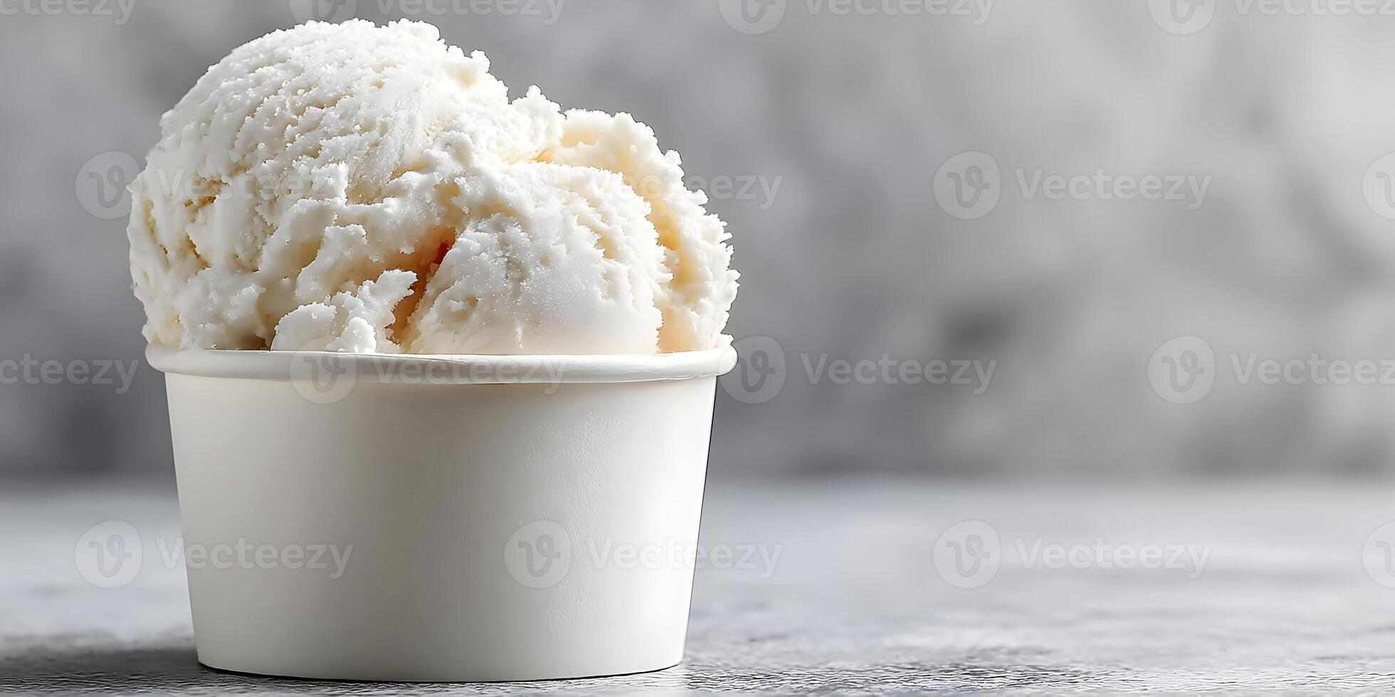 Closeup of Creamy Vanilla Ice Cream in a Small Paper Cup photo