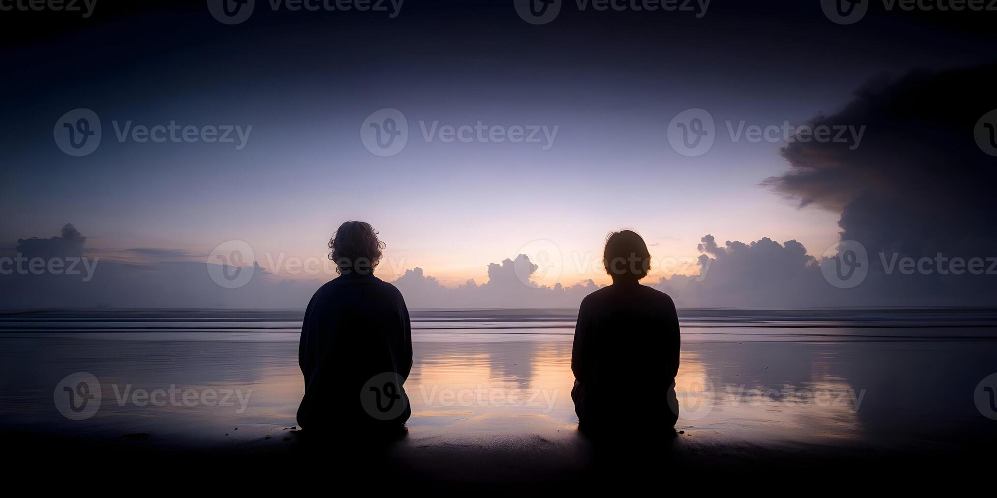 Two People Silhouettes Sitting Beach Sunrise Ocean Sunset Calm Peaceful photo