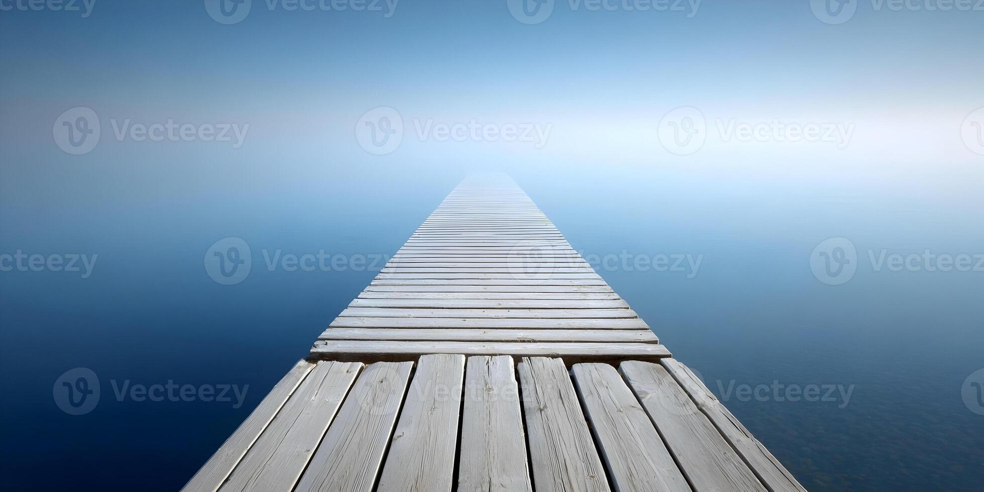 Wooden Dock Extending into Misty Lake Peaceful Calm Serenity Scene photo