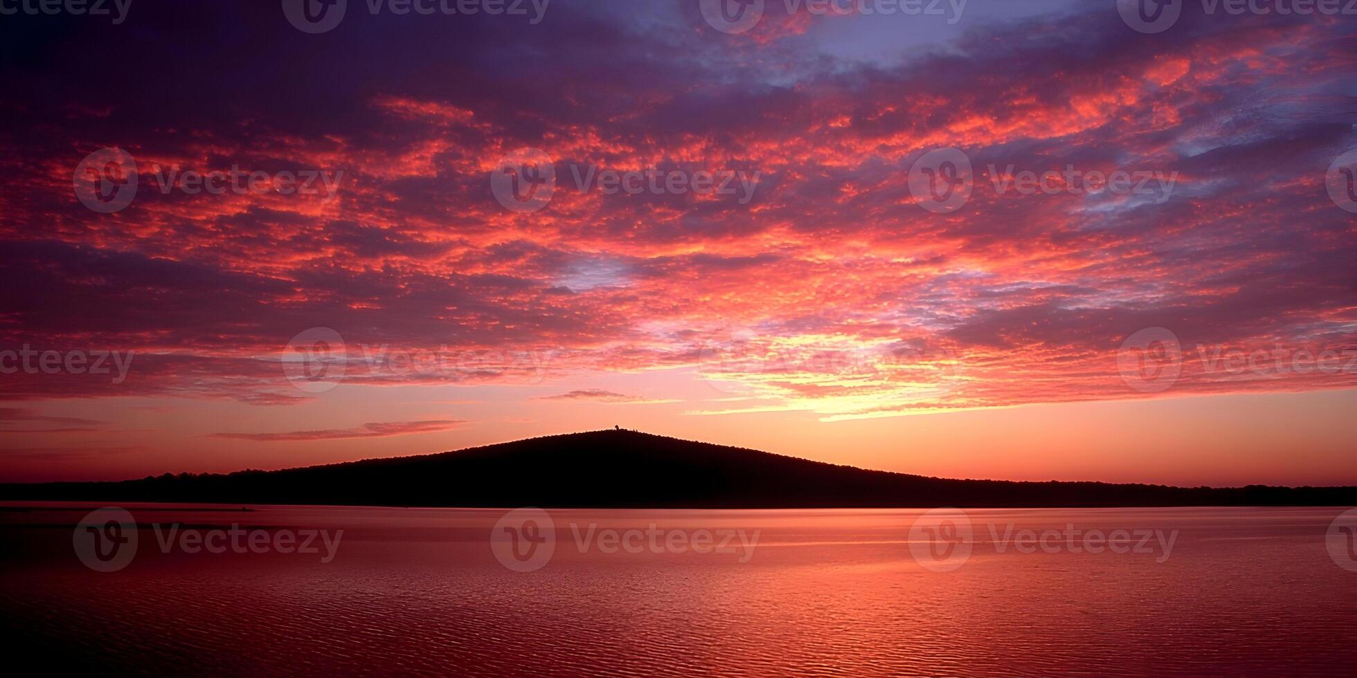 Red Sky Sunset over Lake and Hill Landscape photo
