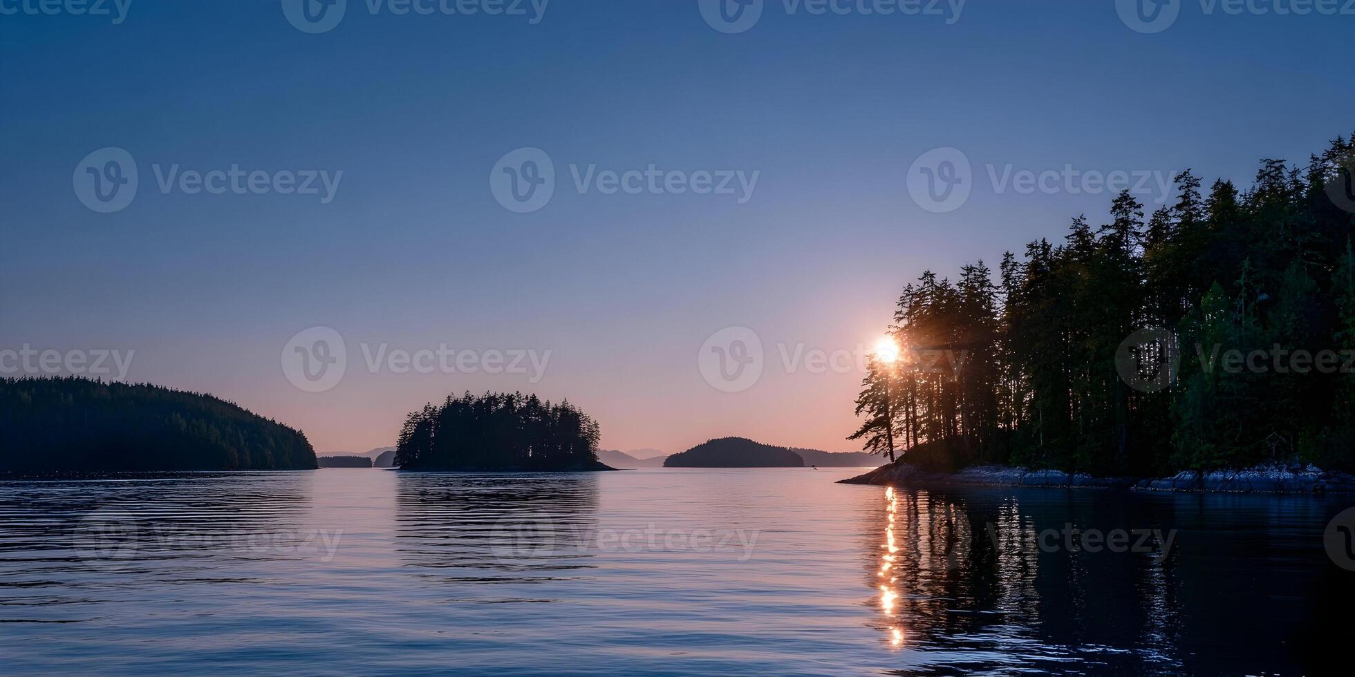 Sunset over Calm Ocean Water with Evergreen Islands photo