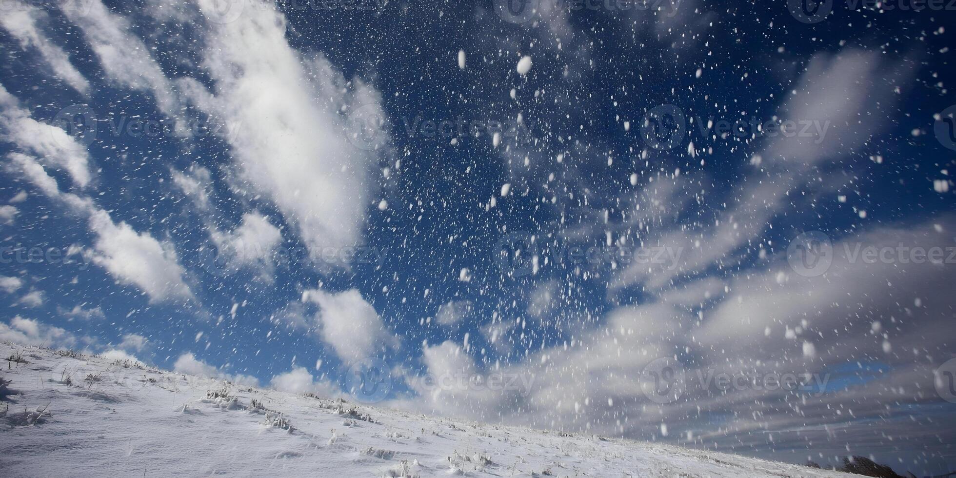 Snowfall Scene Winter Landscape Snowy Hill Blue Sky Falling Snow photo