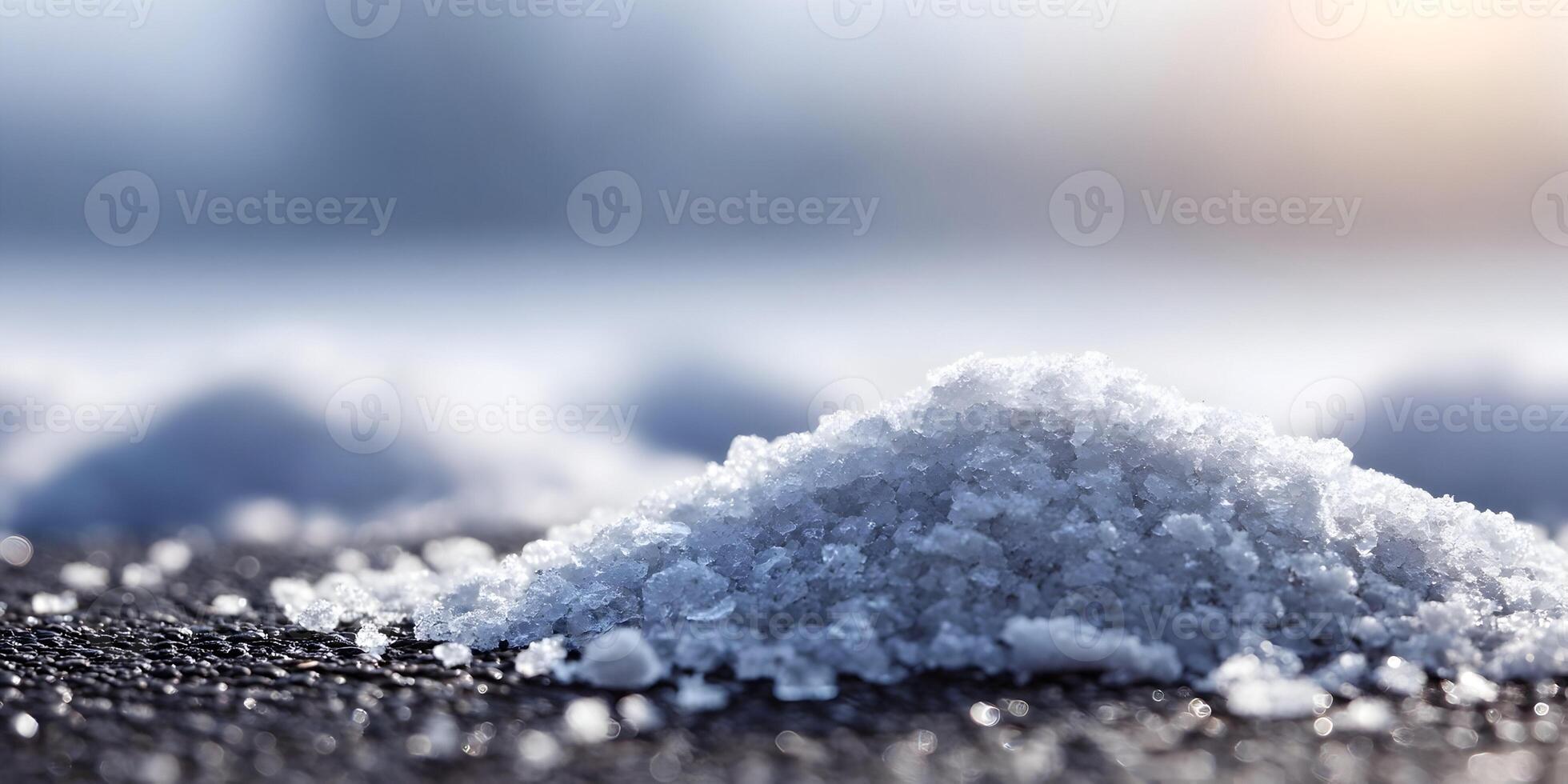 Closeup of Melted Snow Pile on Dark Surface Winter Scene Ice Crystals photo