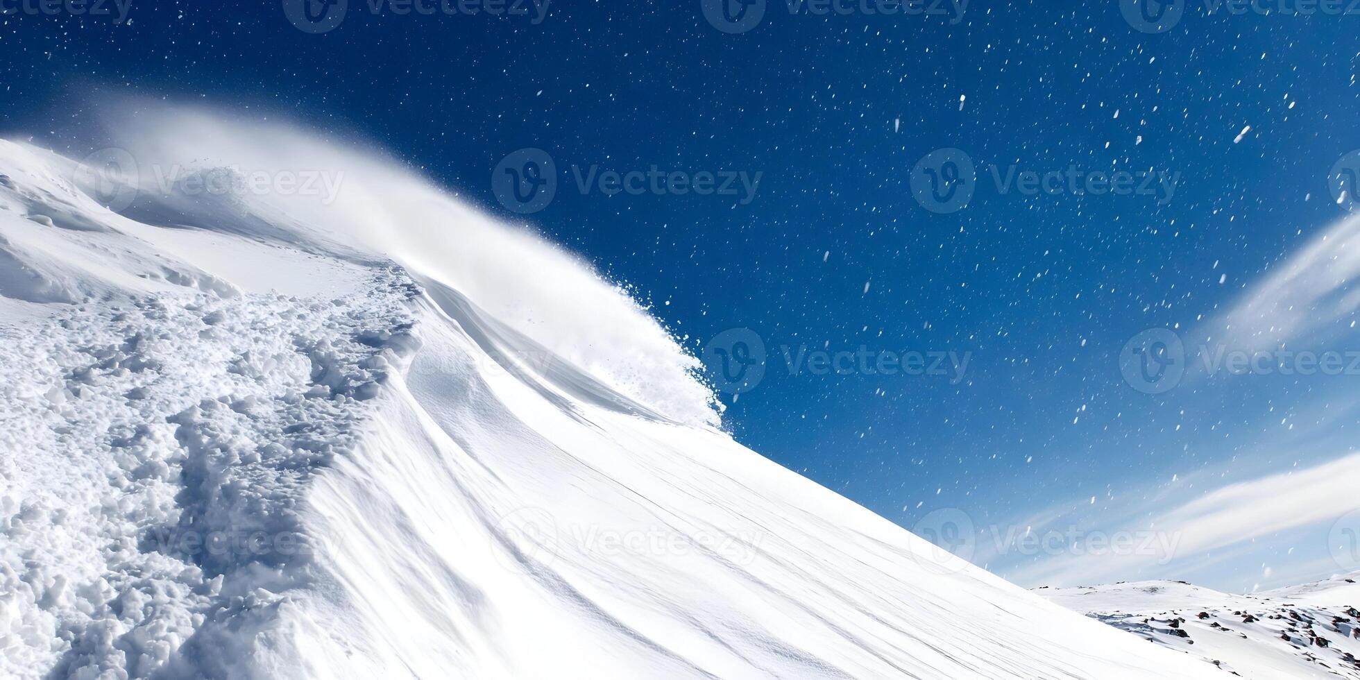 Snowboarding Down Powdery Slope Under Blue Sky with Snow Flying photo