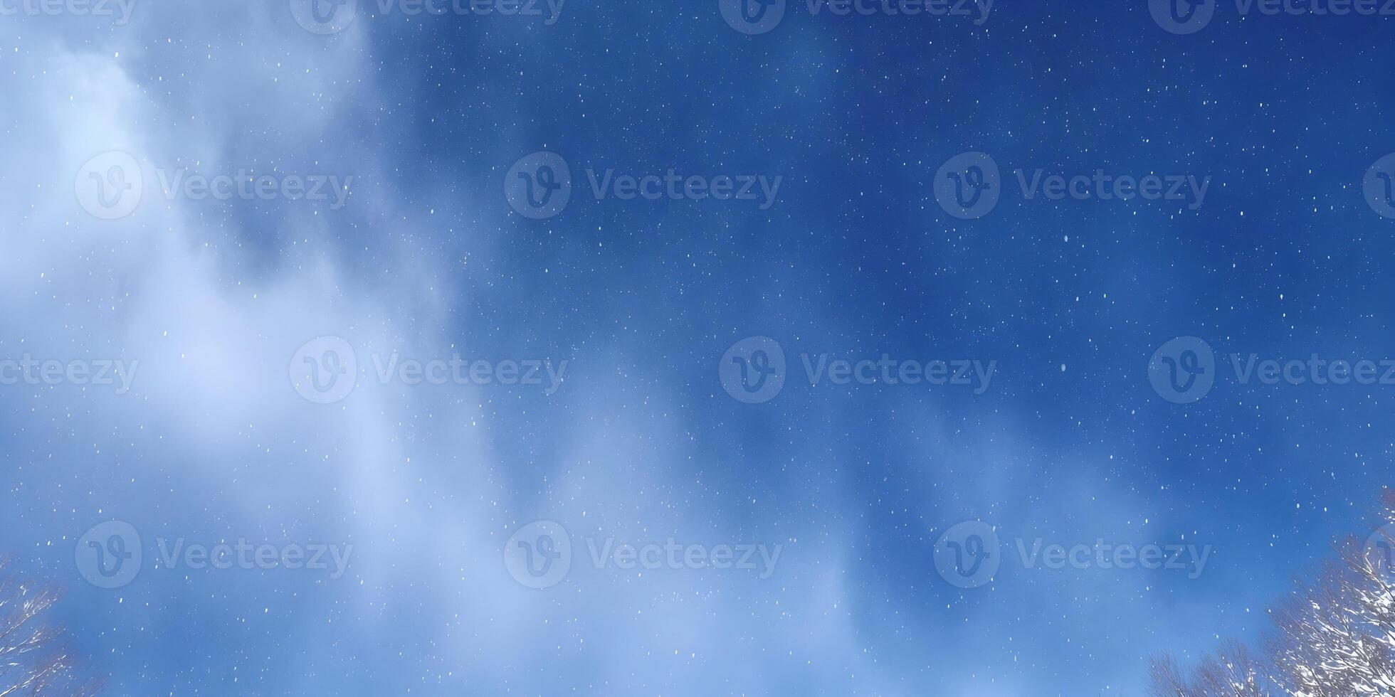 Snowy Sky with Blue Clouds and Falling Snowflakes photo
