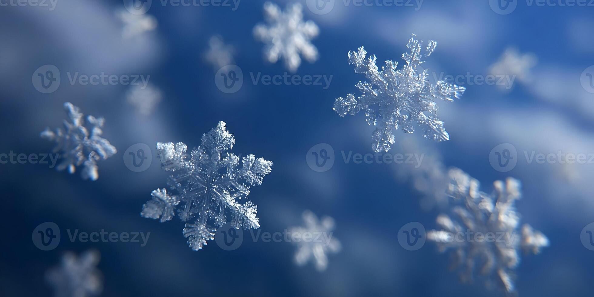 Detailed Closeup of Several Falling Snowflakes Against a Blue Sky Background Winter Snow Crystal Ice Nature photo