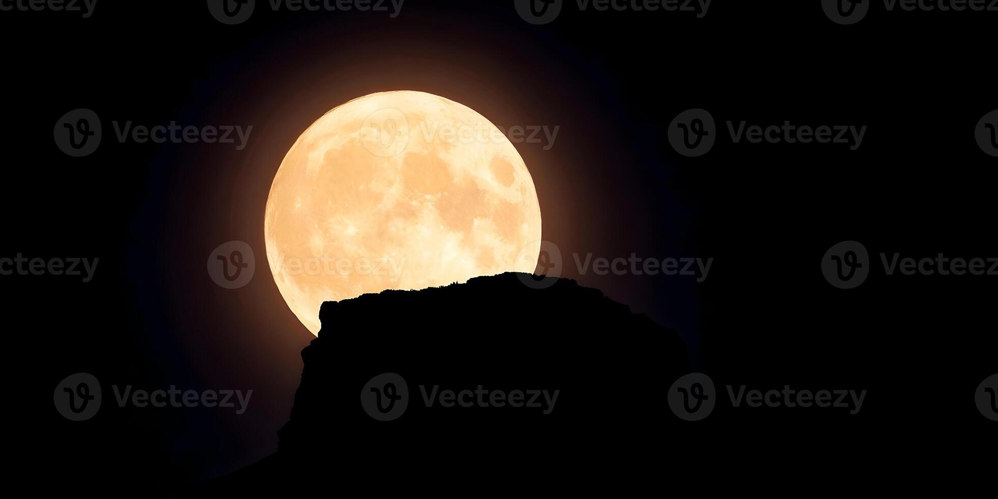 Large Full Moon over Dark Mountain Silhouette Night Sky photo