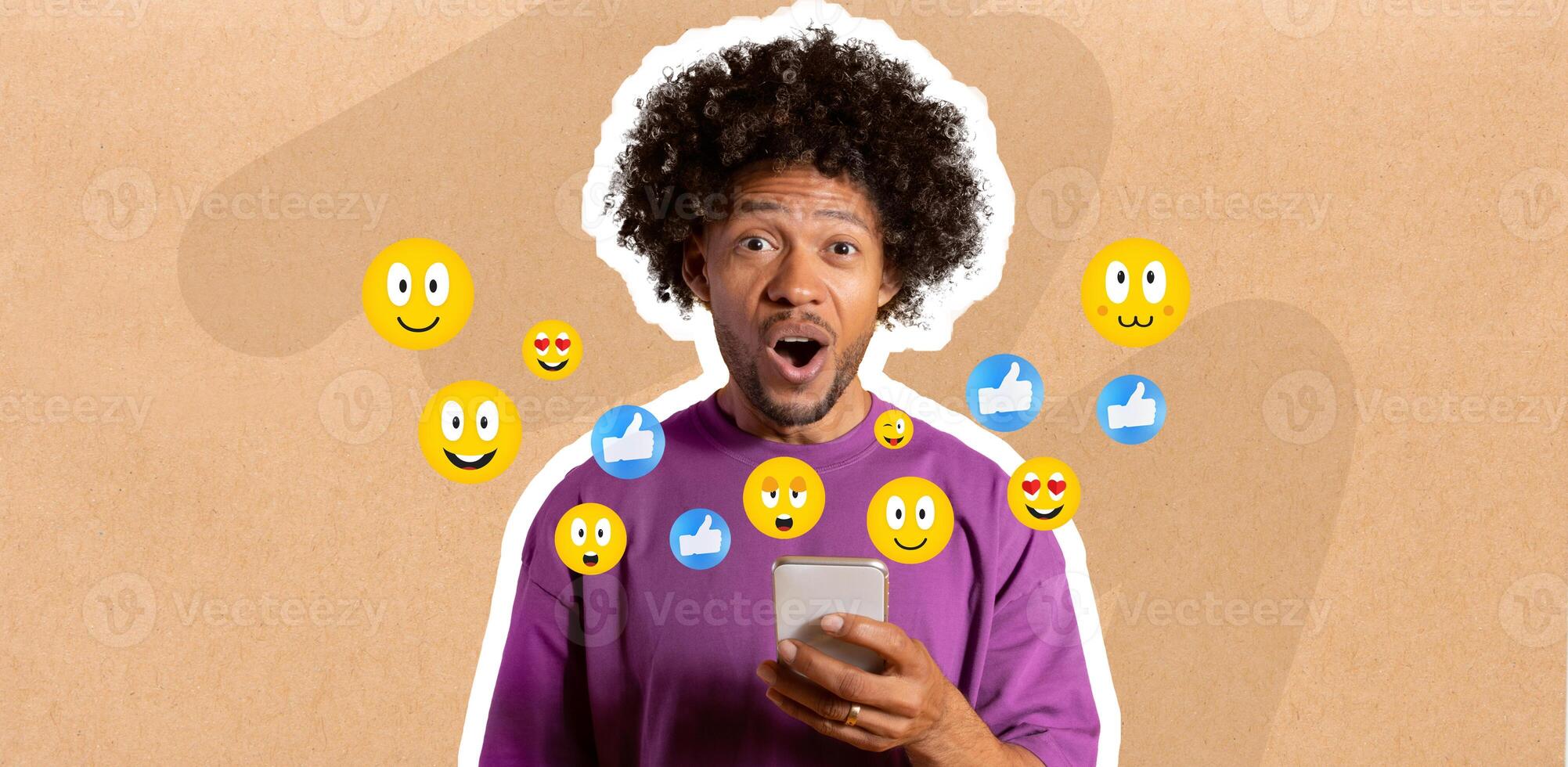 Shocked African American guy with curly hair using smartphone, engaging in messaging. Colorful emojis float around them, indicating interaction and excitement about social media. photo