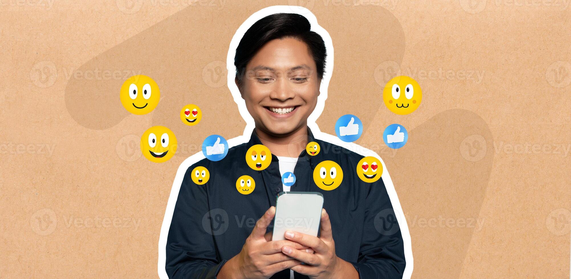 Asian man with a joyful expression is absorbed in his smartphone, chatting and interacting on social media. Emoticons float around, highlighting his cheerful activity. photo