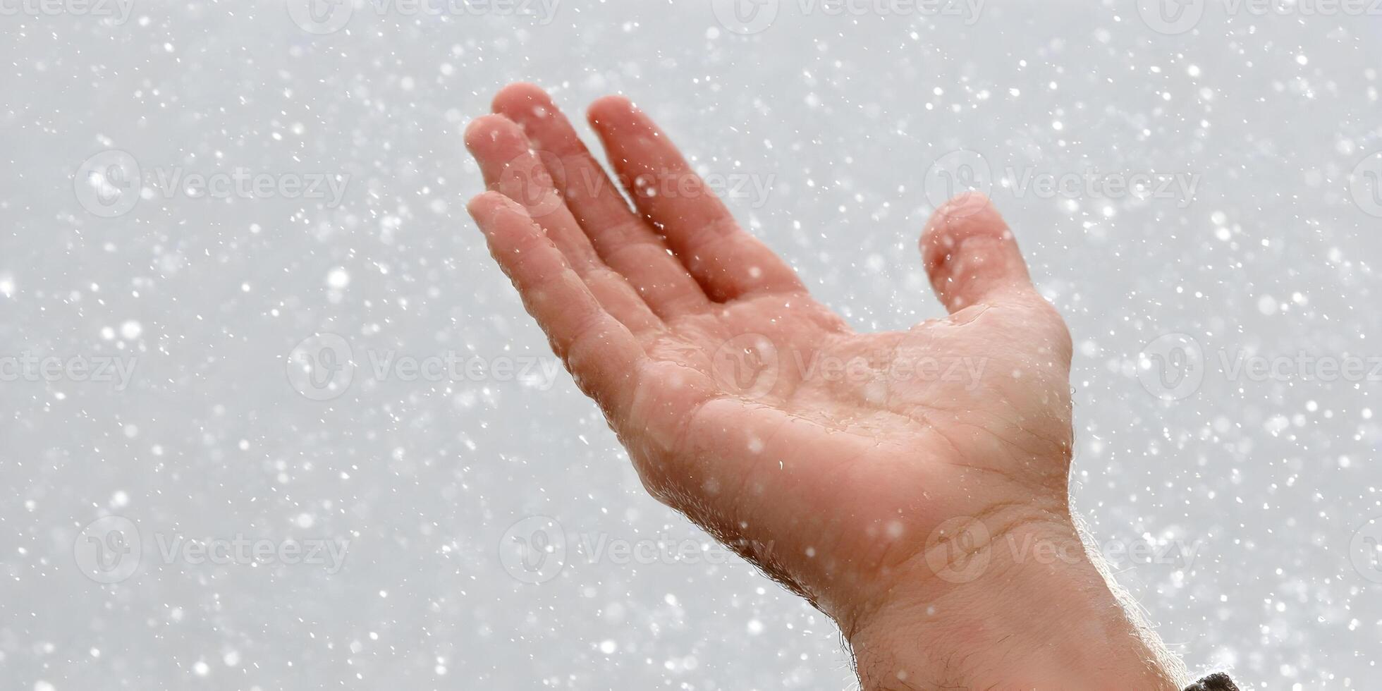 Hand Open in Falling Snow Winter Season Closeup photo
