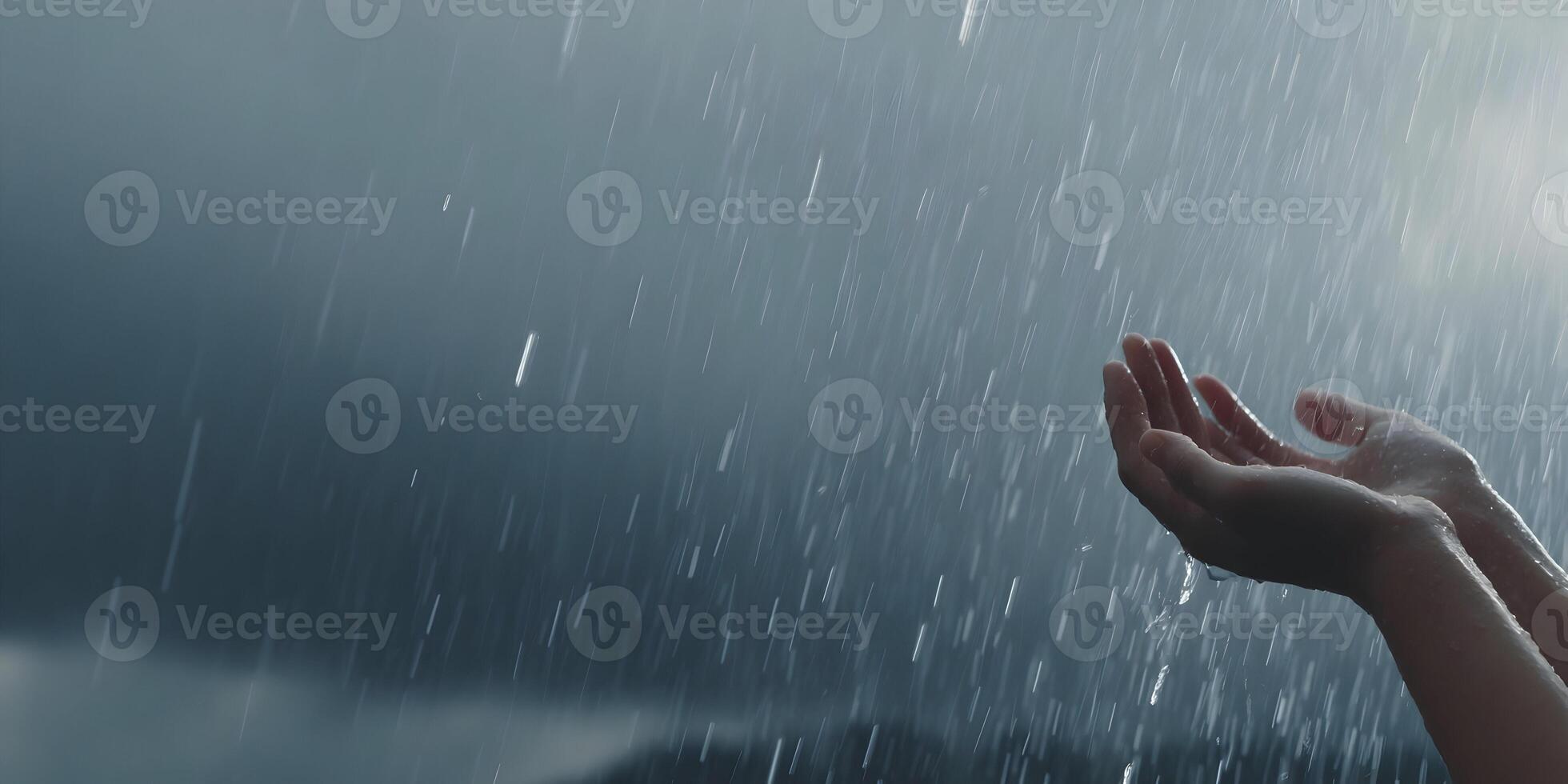 Hands Catching Rain Drops in Heavy Downpour Dark Sky photo