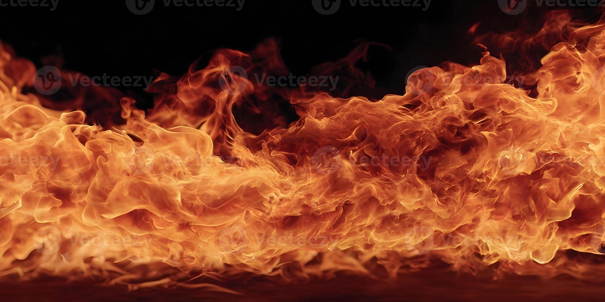 Fiery Orange Flames Burning Brightly Against Black Background Detailed Texture Intense Heat photo