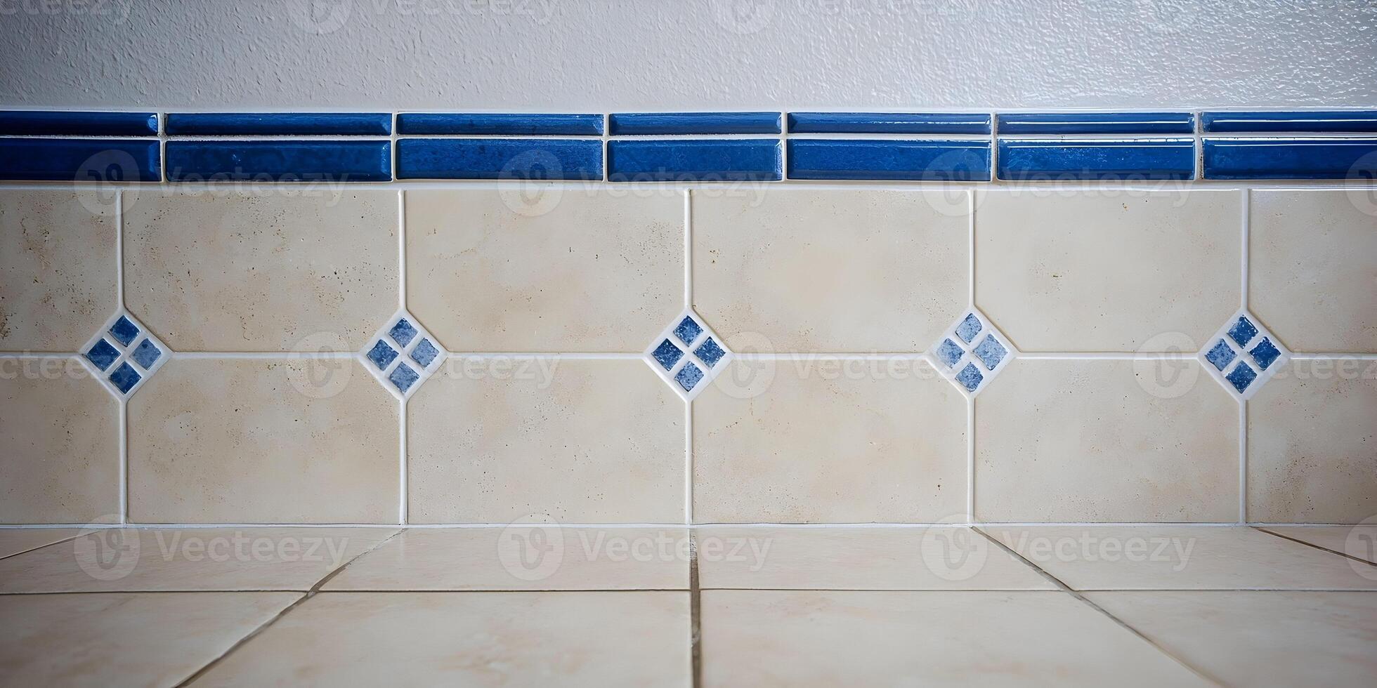 Beige Tile Wall with Blue Diamond Accents and Border photo