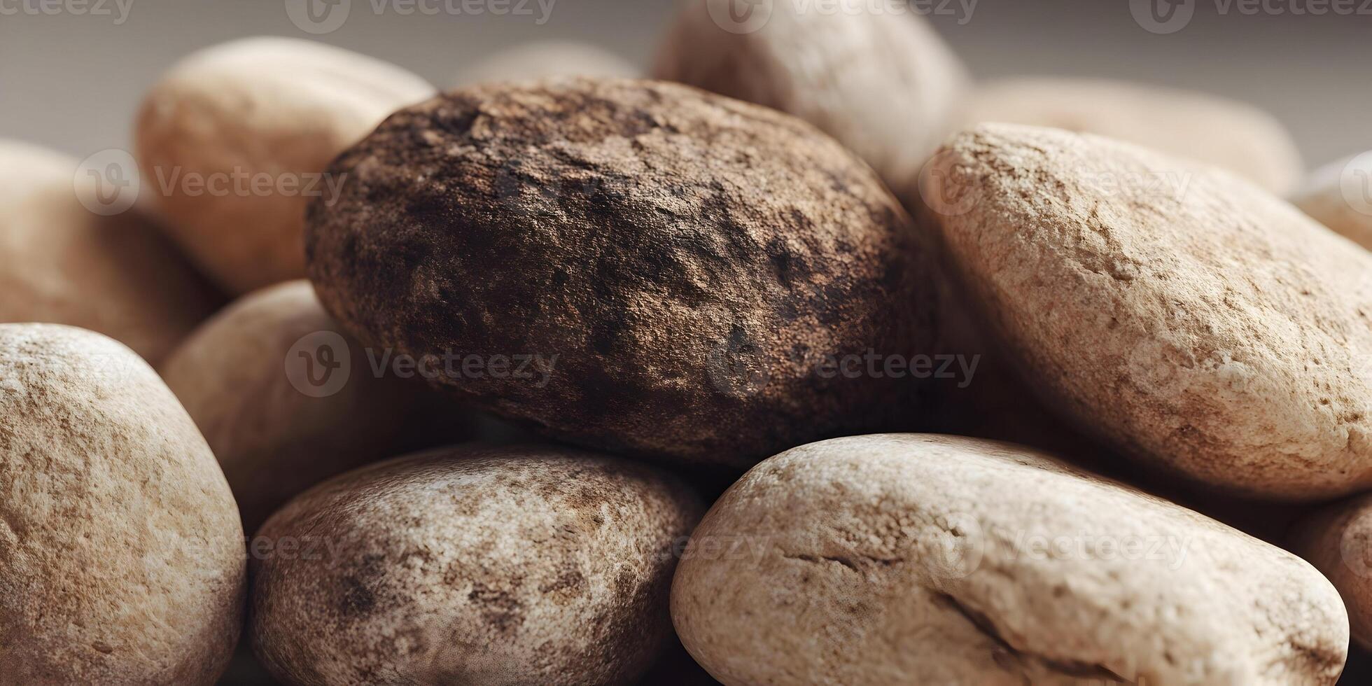 Closeup Brown and Beige Stones Texture Pile Smooth Pebbles photo