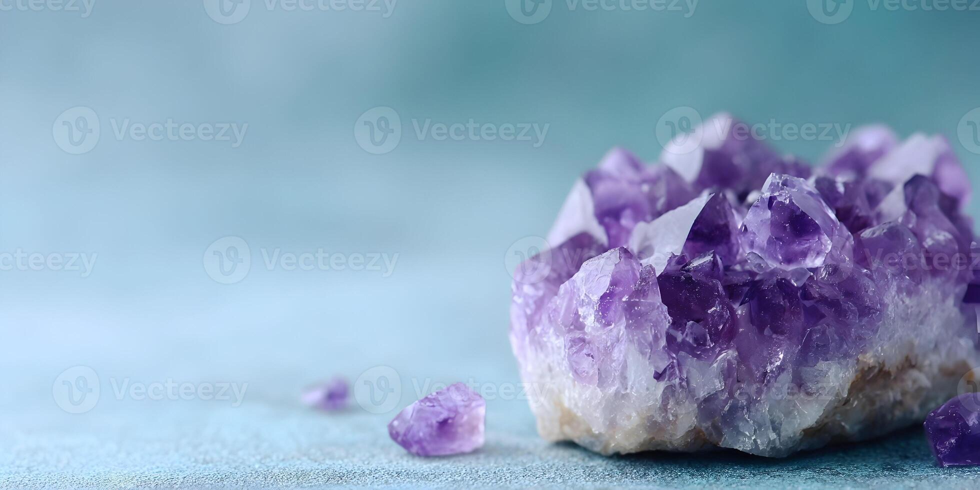 Amethyst Cluster Geode Purple Crystals on Turquoise Background photo