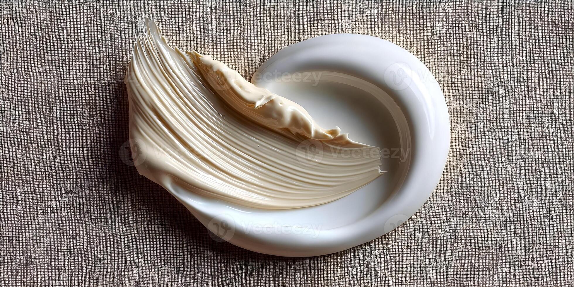 Beige Cream Swirl on White Plate Linen Texture Background photo