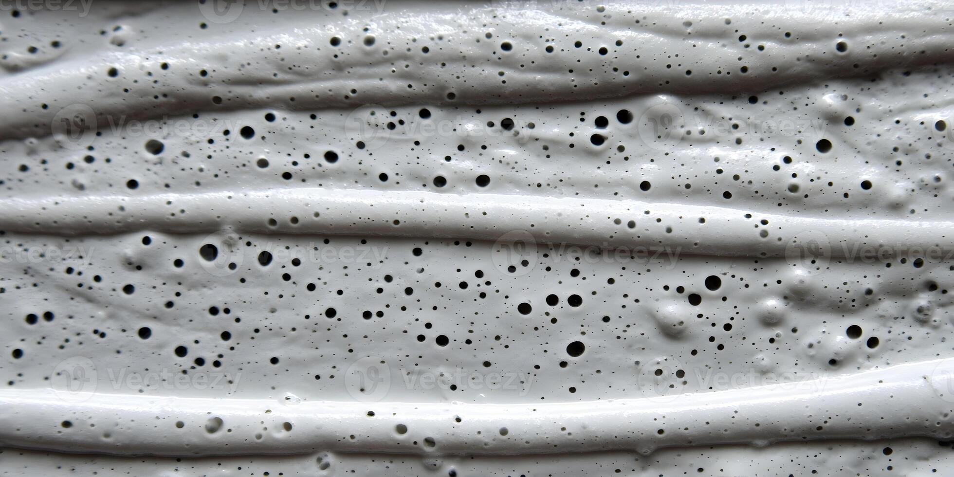 Gray Textured Paint Swirl with Air Bubbles Close Up Detailed Surface photo