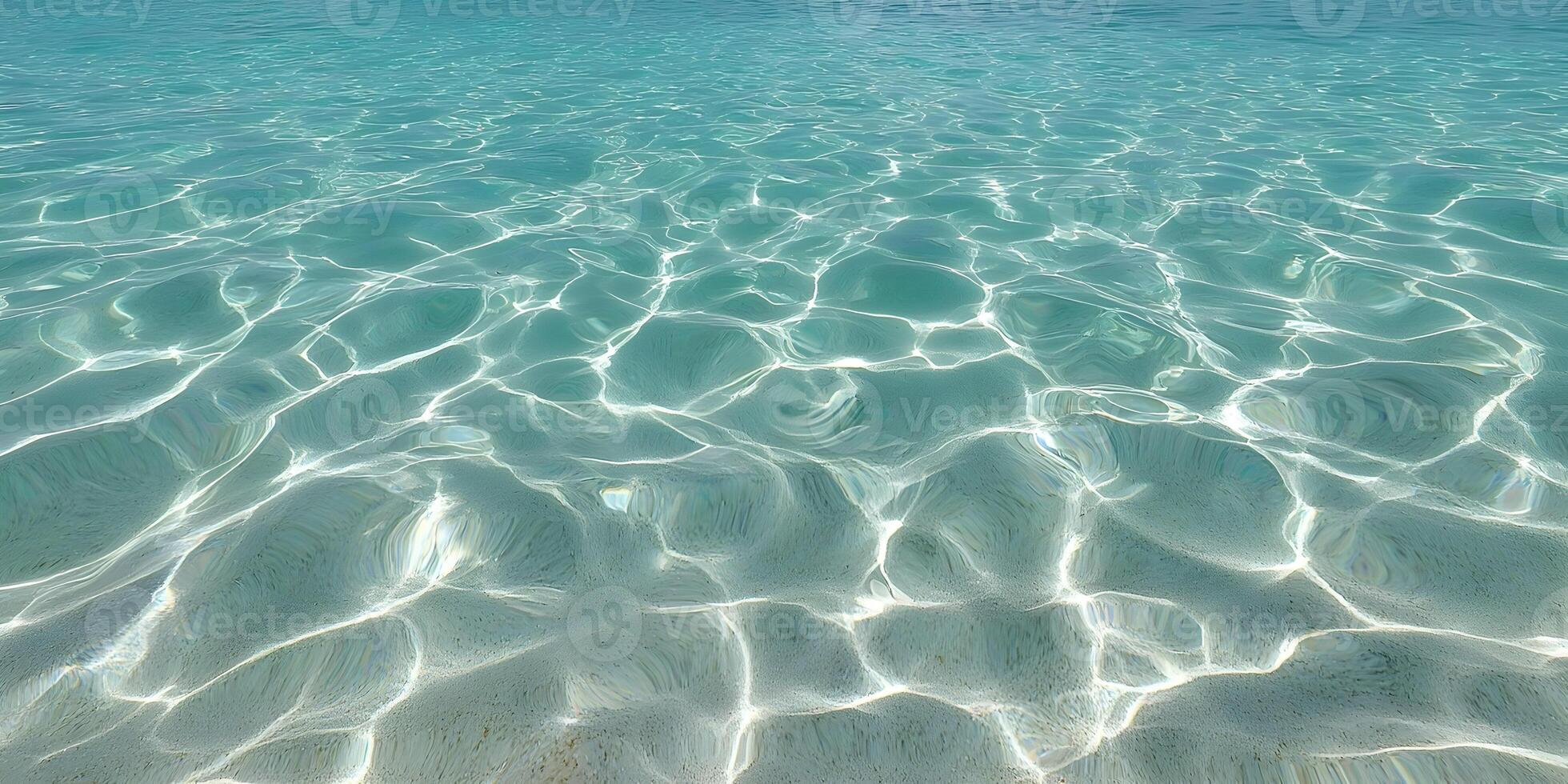 Shallow Clear Ocean Water with Light Reflections and Sandy Bottom photo