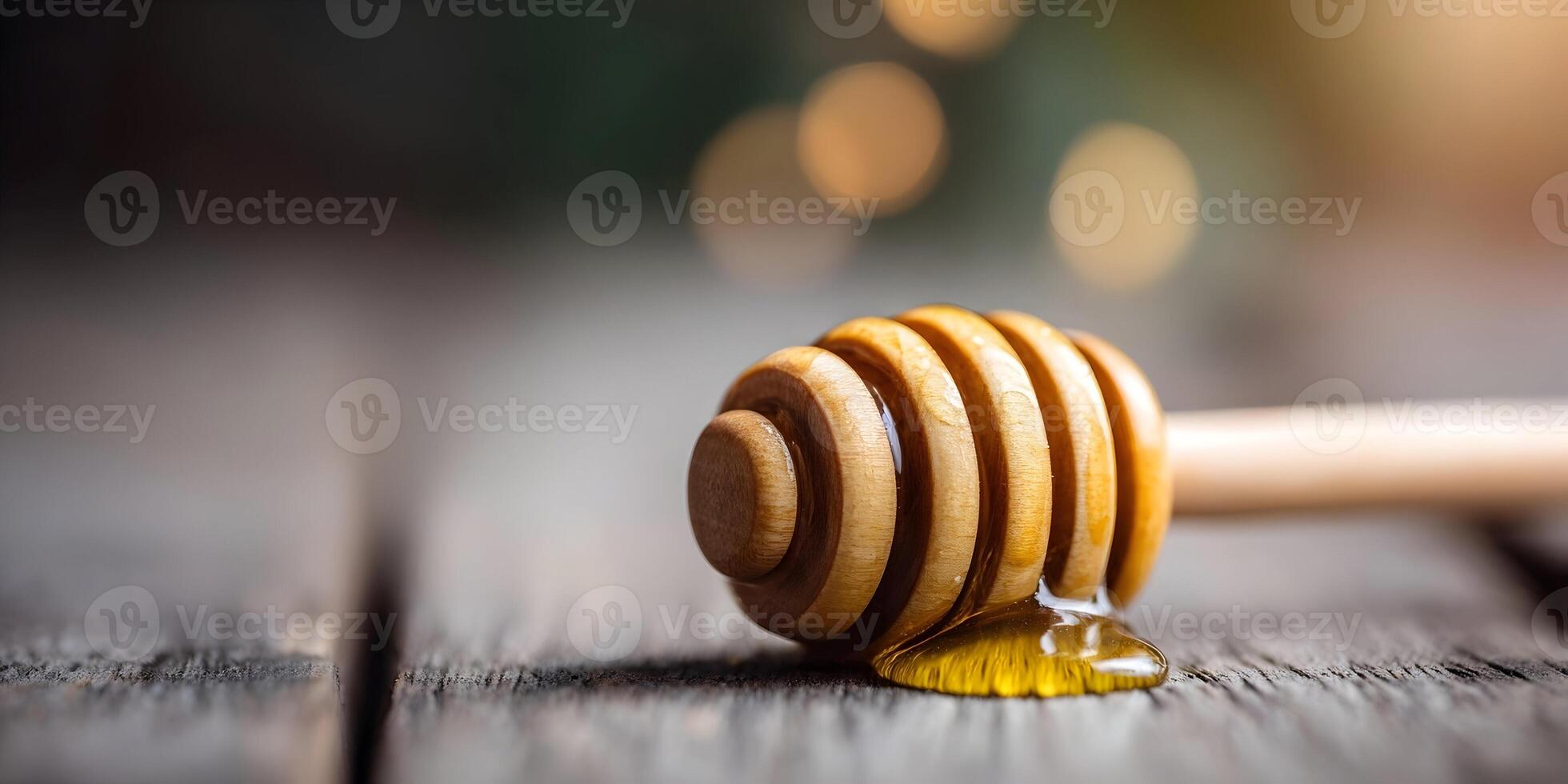 Wooden Honey Dipper with Honey Dripping on Rustic Wood Background photo