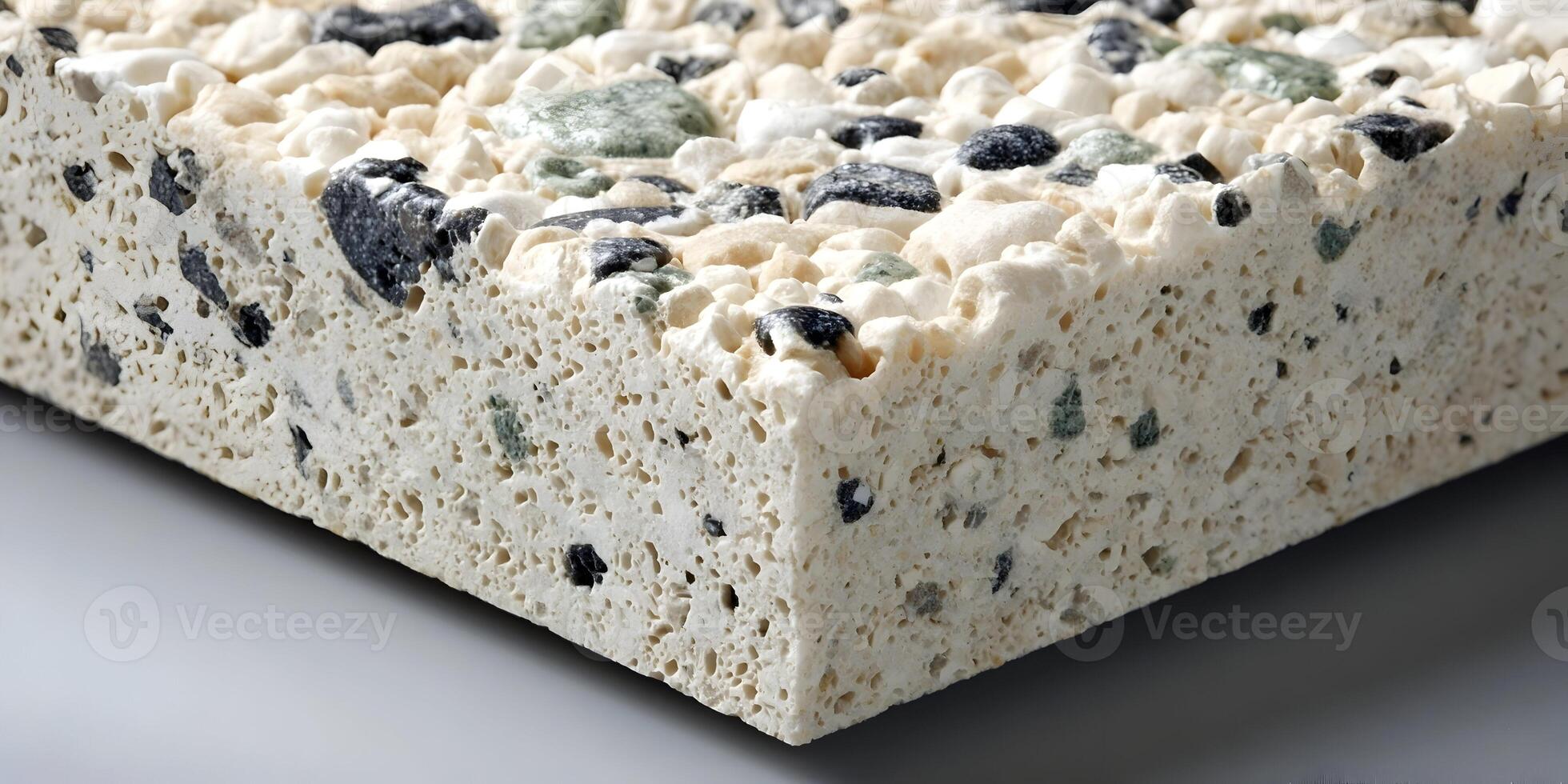 Closeup Beige Aggregate Sample with Black and Green Stones photo