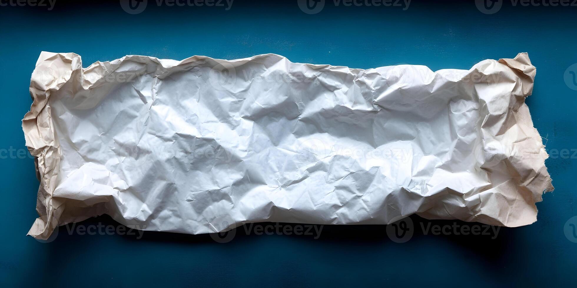 White Crumpled Paper Texture Brown Edges Teal Background photo