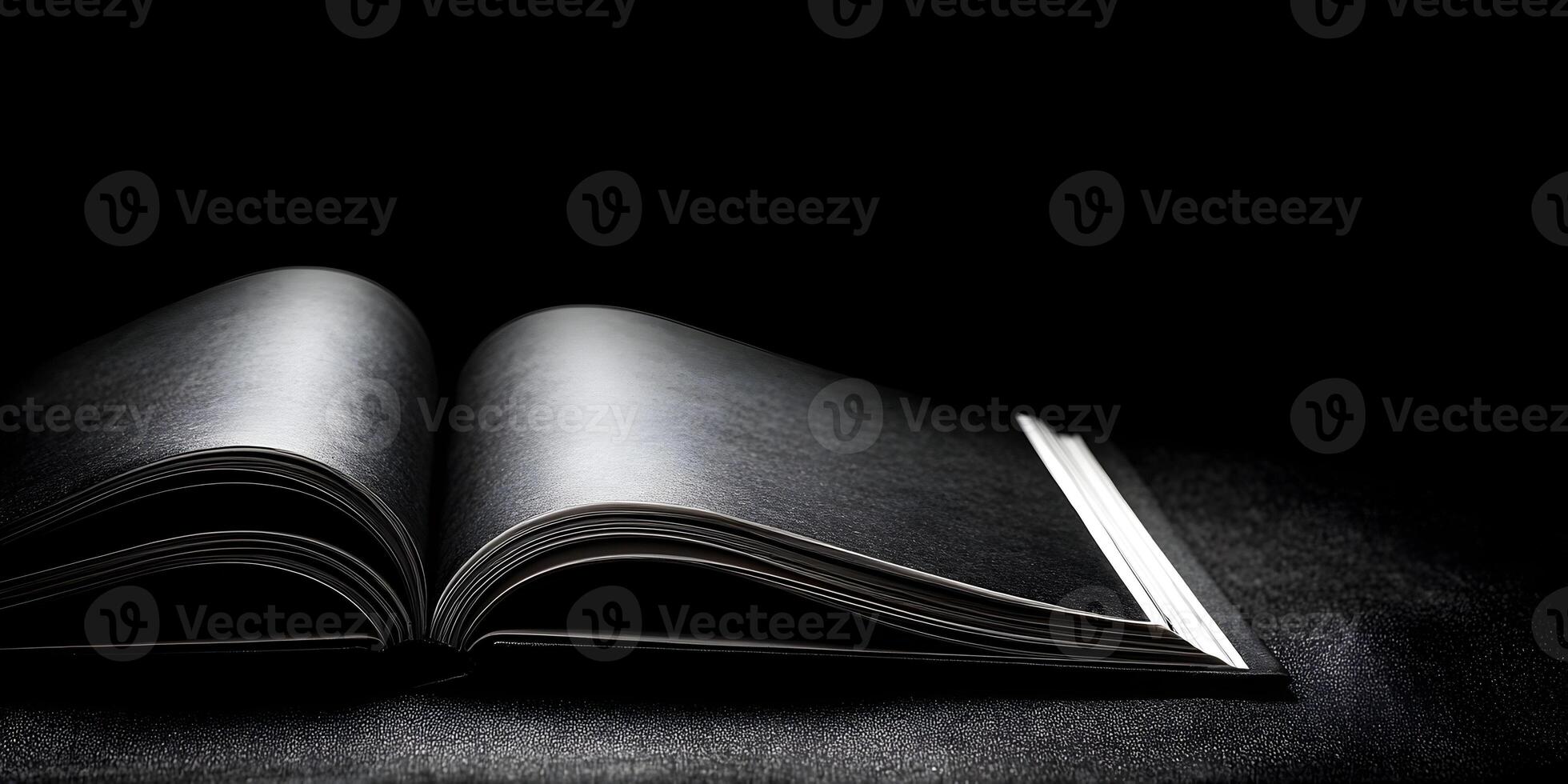 Open Black Book on Dark Surface Dramatic Low Key Lighting Photography photo