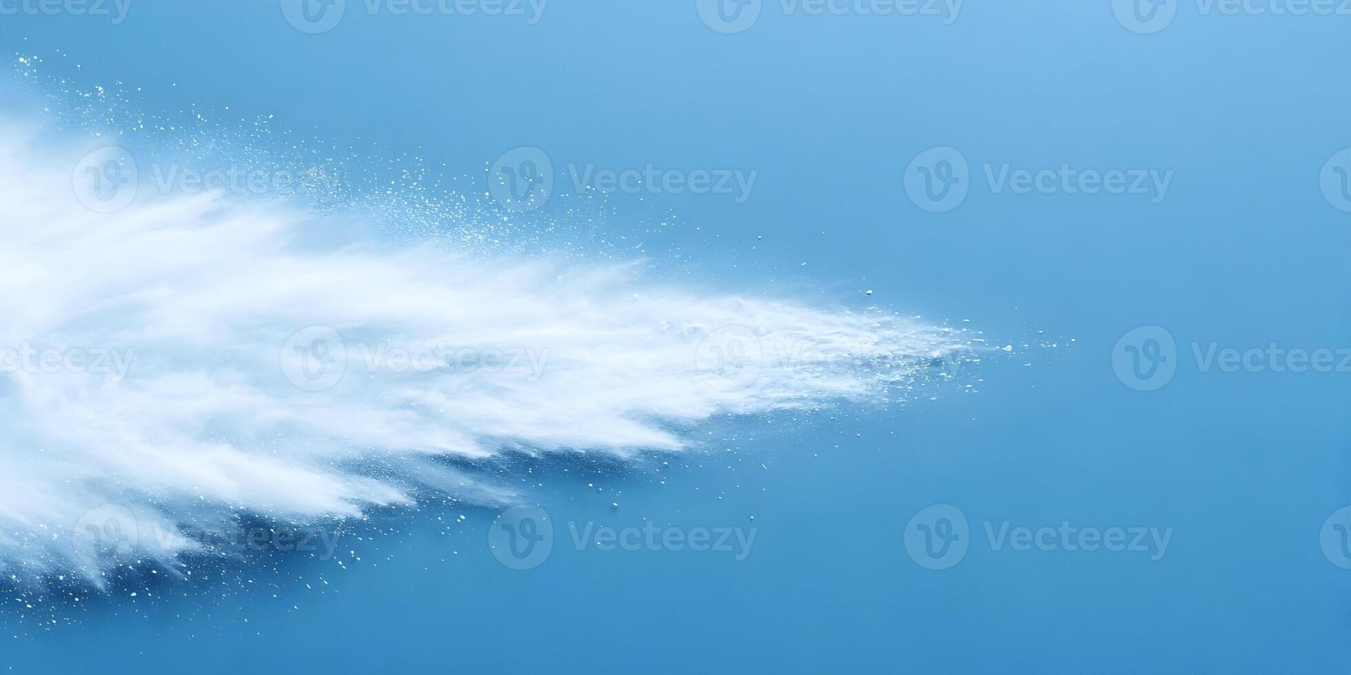 White Powder Explosion on Blue Background photo