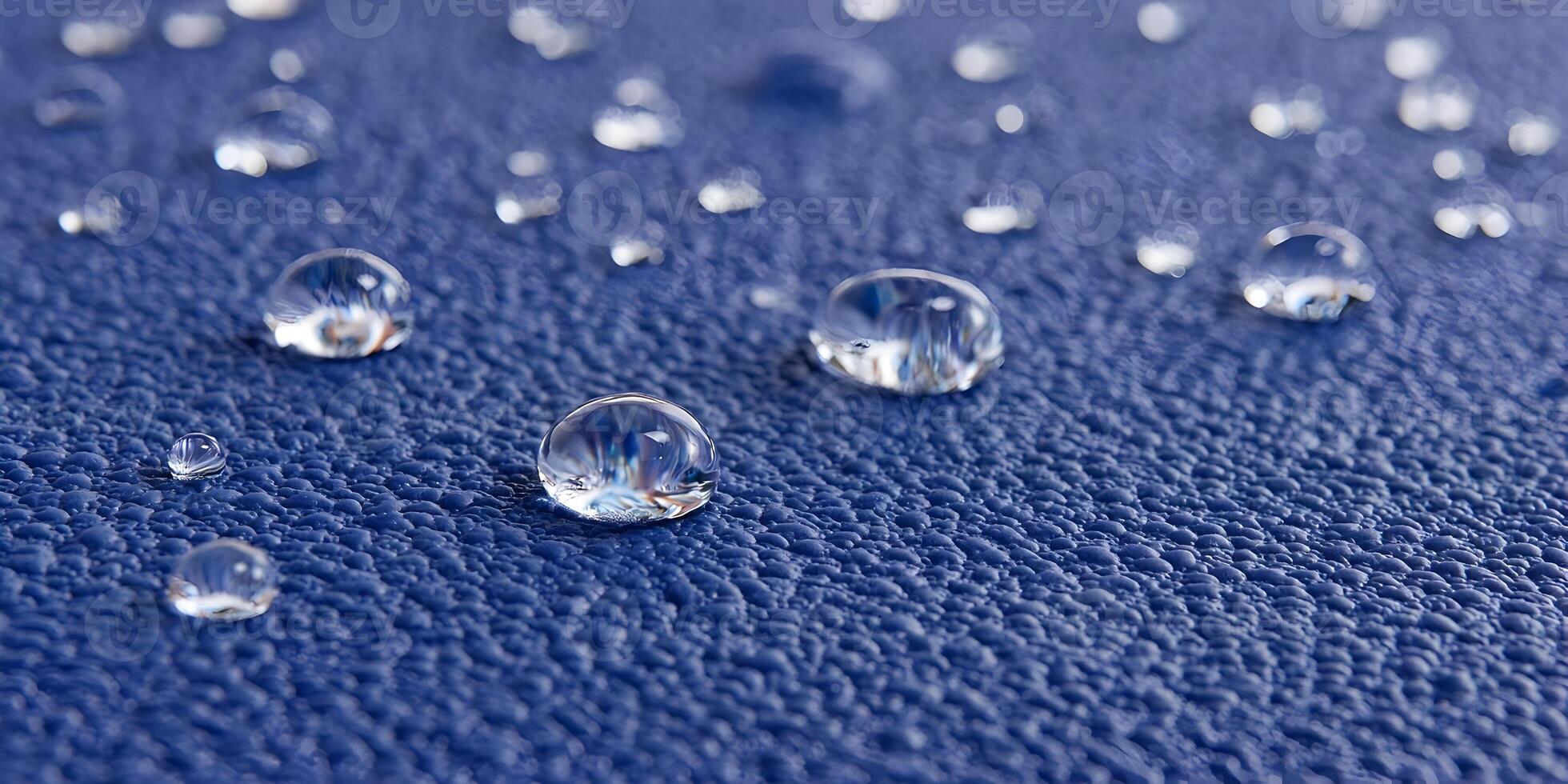 Water Droplets on Blue Textured Surface Closeup Macro Photography photo