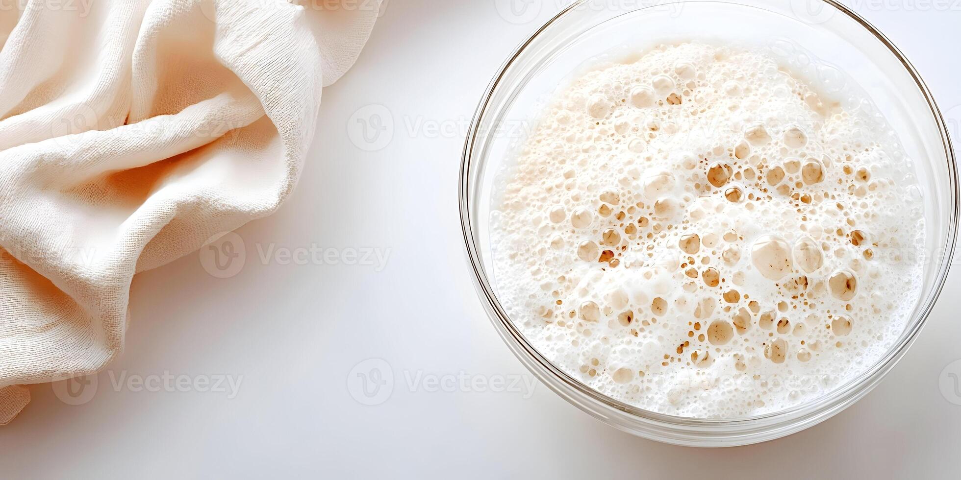 Oatmeal In Glass Bowl With Creamy Foam Bubbles Top View photo