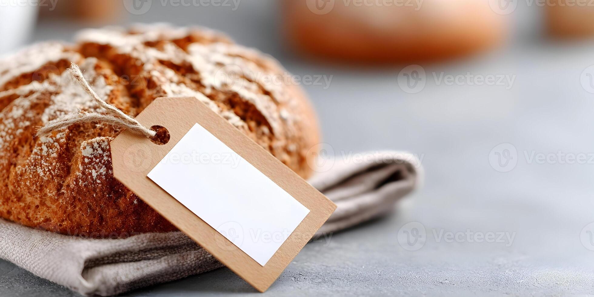 Round Loaf Bread with Blank Price Tag on Linen Napkin photo