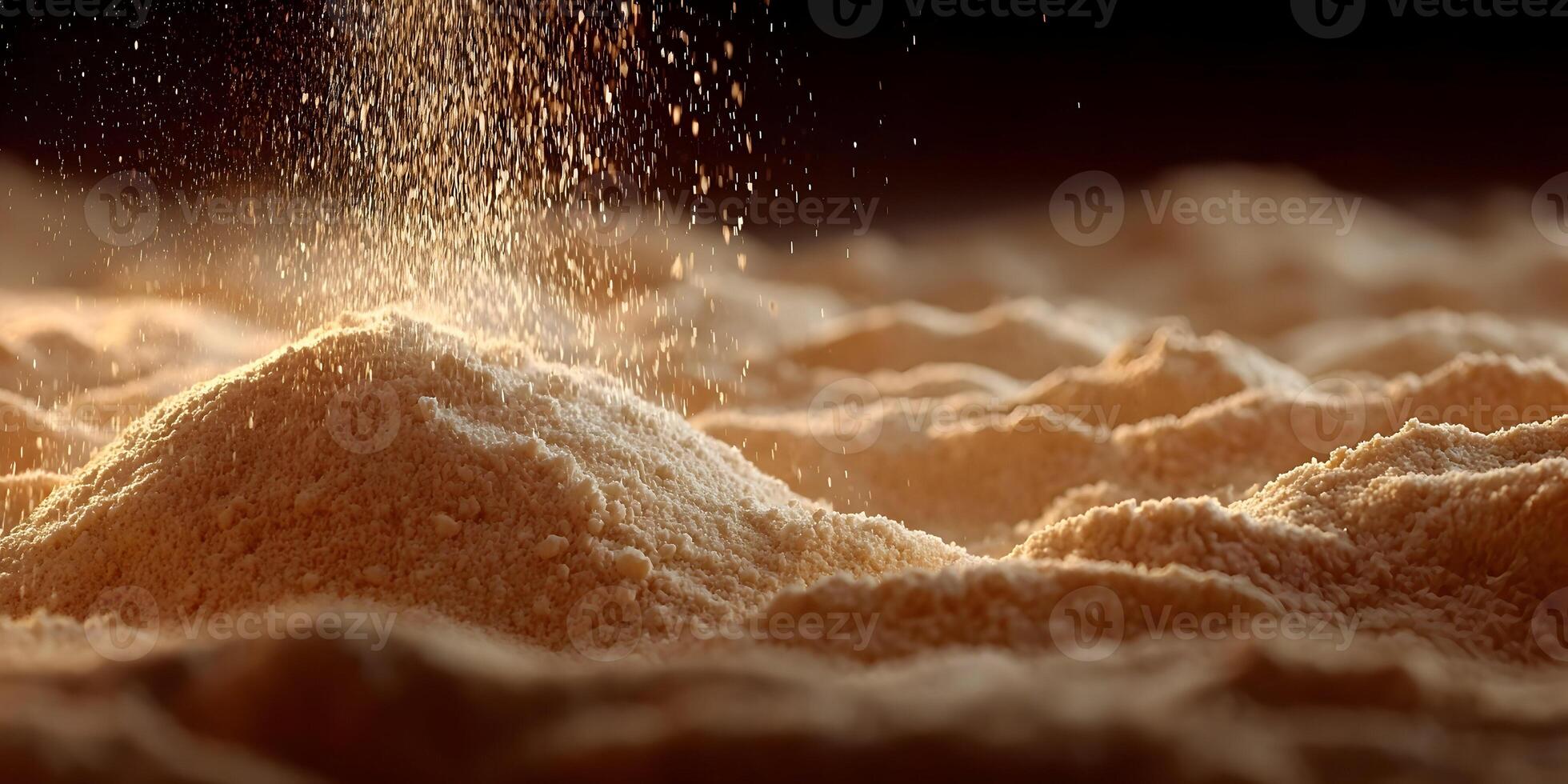 Powder Falling on Pile of Beige Granular Substance Close Up photo