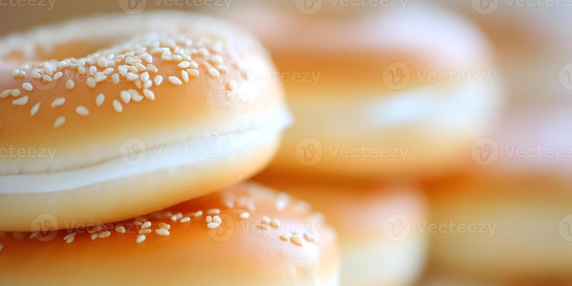 Closeup of Sesame Seed Bagels with Cream Cheese Stacked High photo