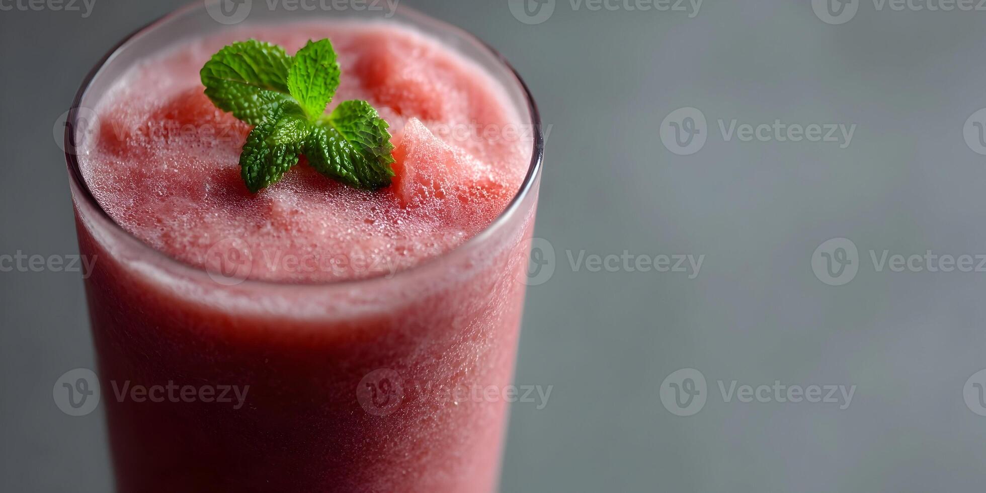 Refreshing Watermelon Smoothie in Glass with Mint Garnish Closeup photo