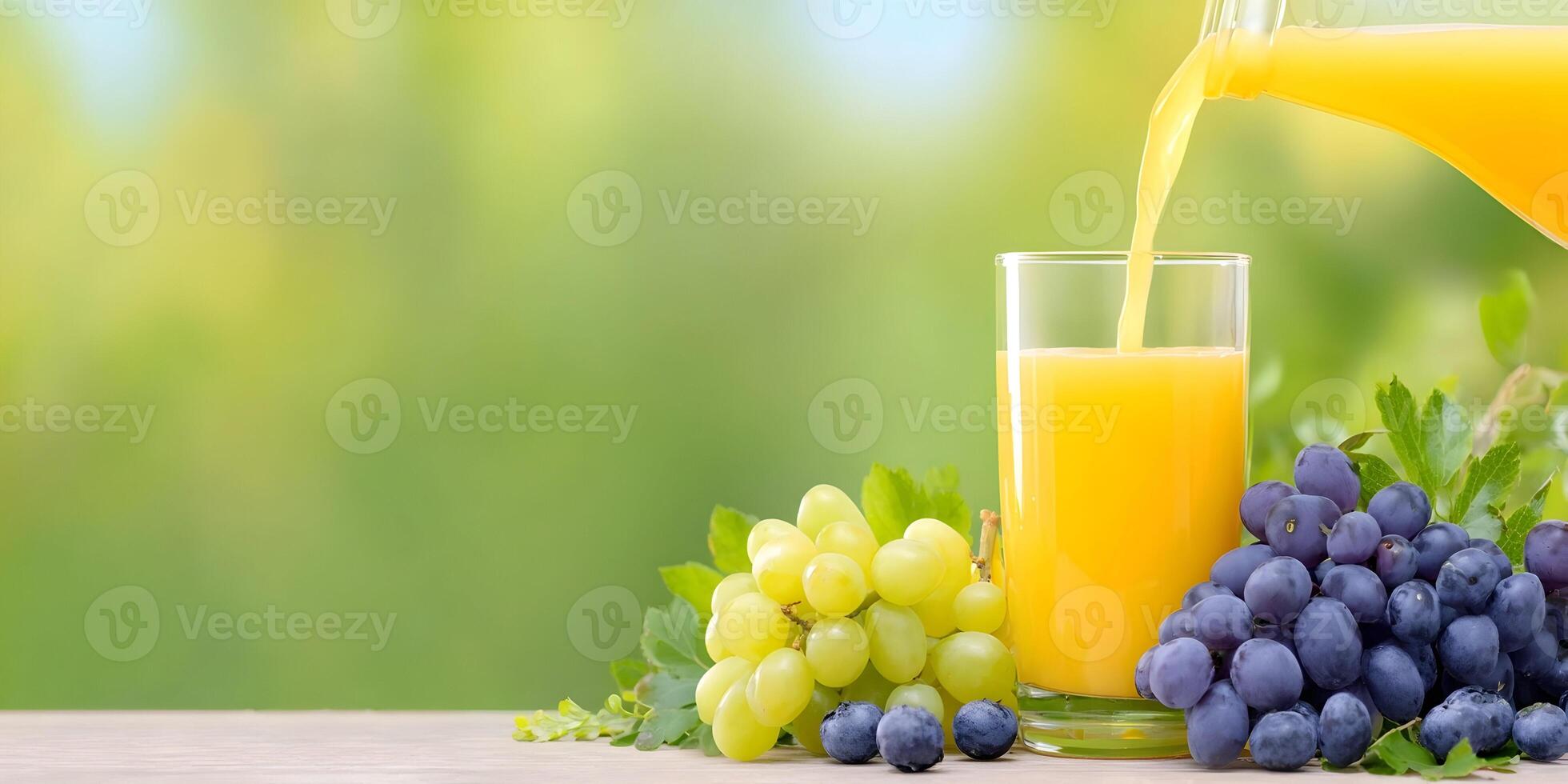 Fresh Grape Juice Pouring into Glass with Green and Purple Grapes photo