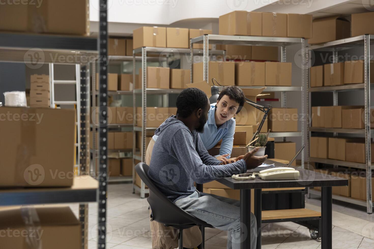 Small business depot captures product handling and delivery service operations within a warehouse full of inventory, diverse workers managing orders and shipping logistics. Distribution. photo