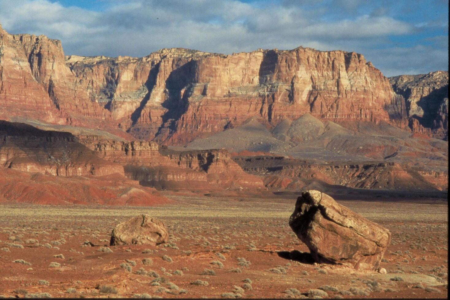 A Desert Canyon Vista with Eroded Boulders and Expansive Sky photo