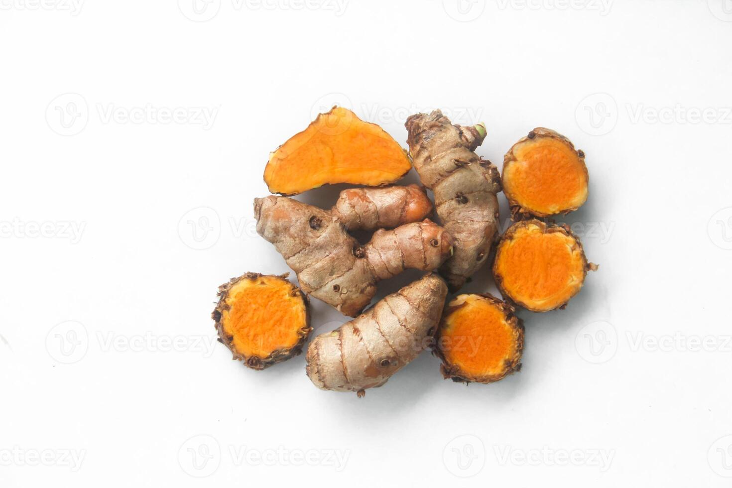 Tubers of the Curcuma zanthorrhiza or temulawak plant arranged on a white background photo