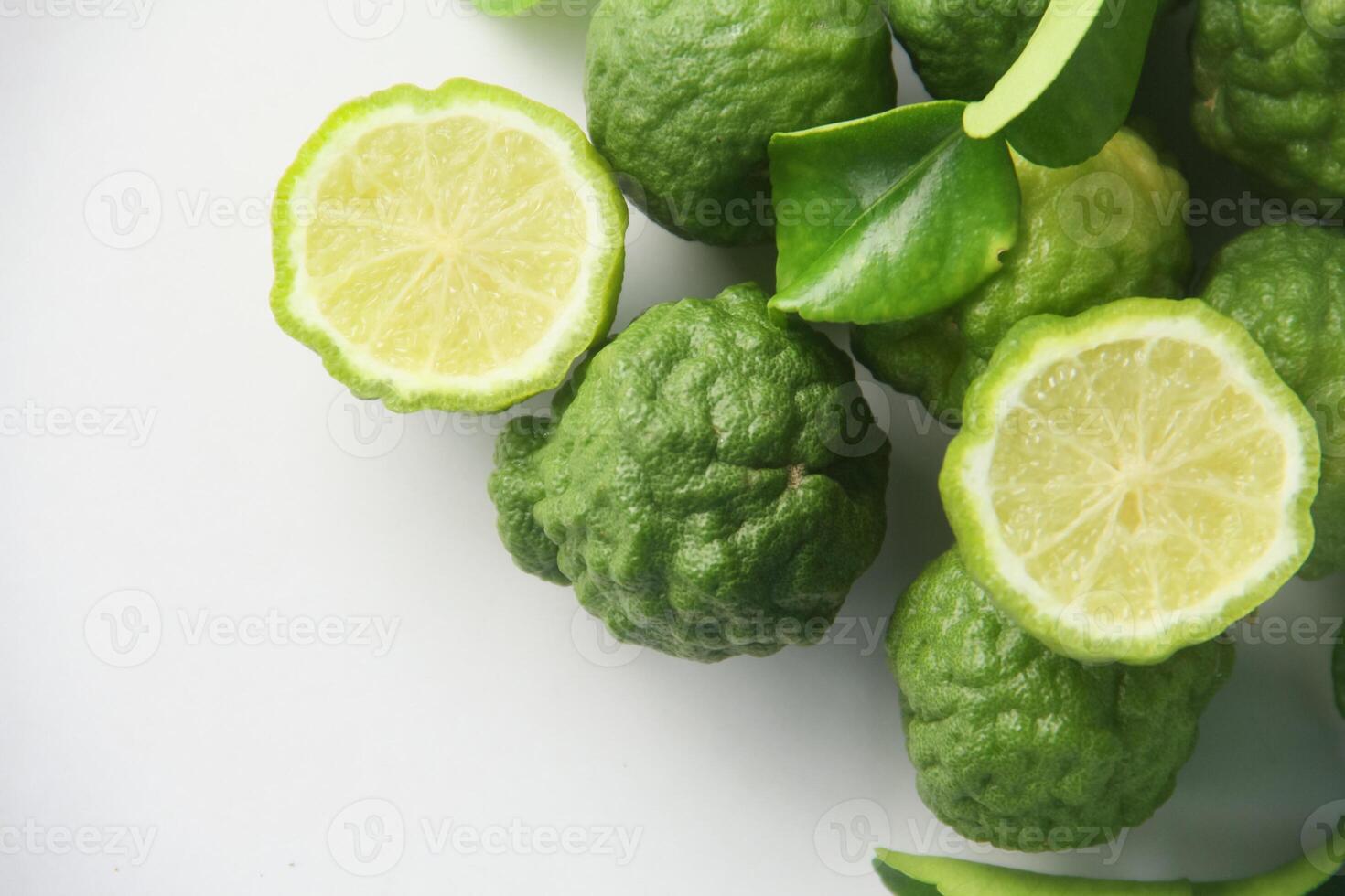 A close up of some limes and leaves photo