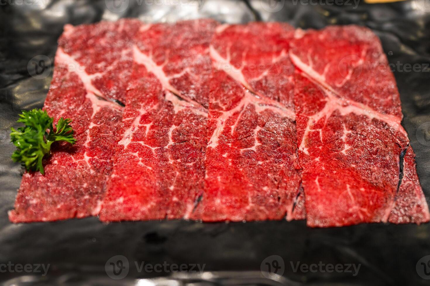 Premium rare slice of raw beef meat. photo