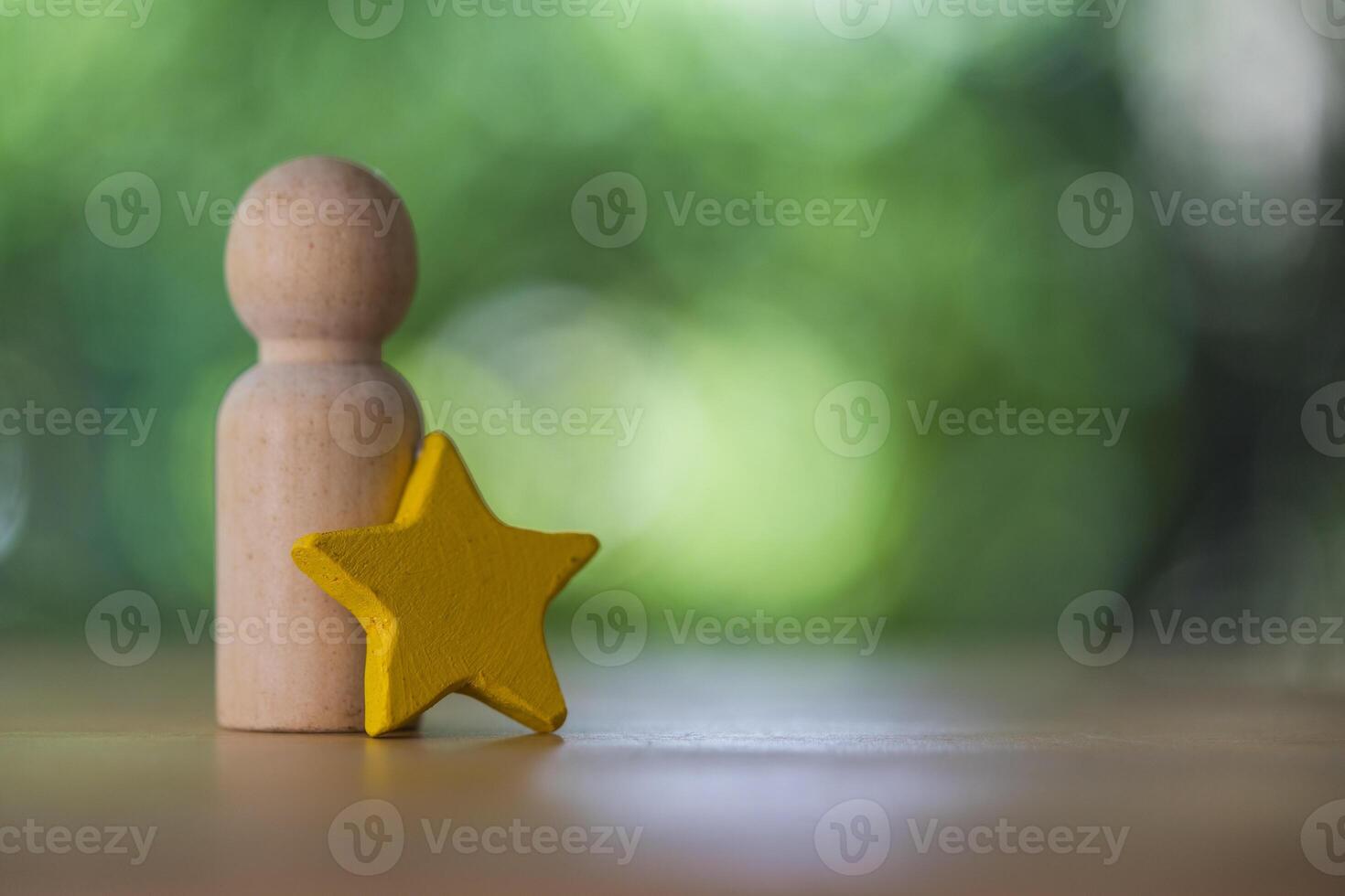 Wood figures peg doll standing together with yellow star. Talent, Human resources. photo