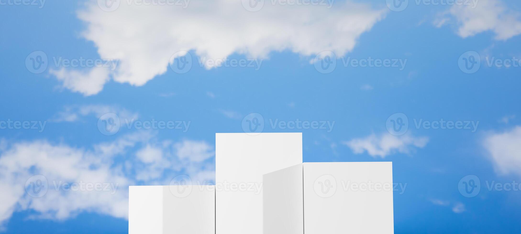 Three white geometric blocks of varying heights, resembling a podium or steps, set against a clear blue sky with white clouds, ideal for showcasing products, rankings, achievement and progress. photo