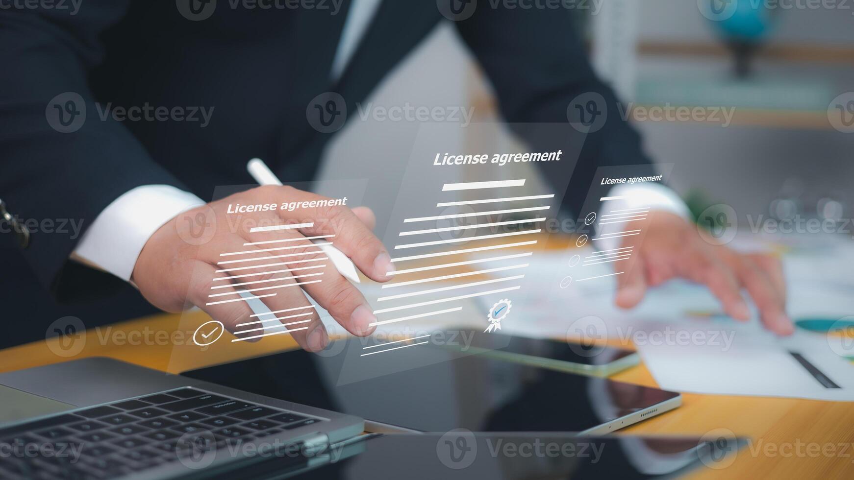 License agreement, featuring digital checkmarks and signatures. Symbolizes efficient online contract management and modern legal agreements. Businessman uses a stylus to interact with documents. photo