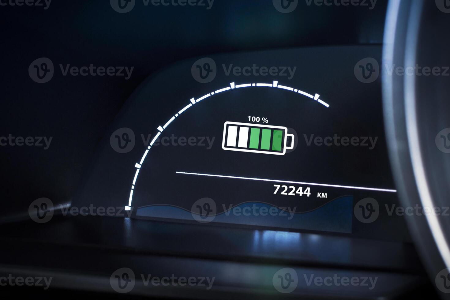 Electric vehicle dashboard showing a 100 percentage battery fully charge. EV, green energy, sustainable transport technology. photo