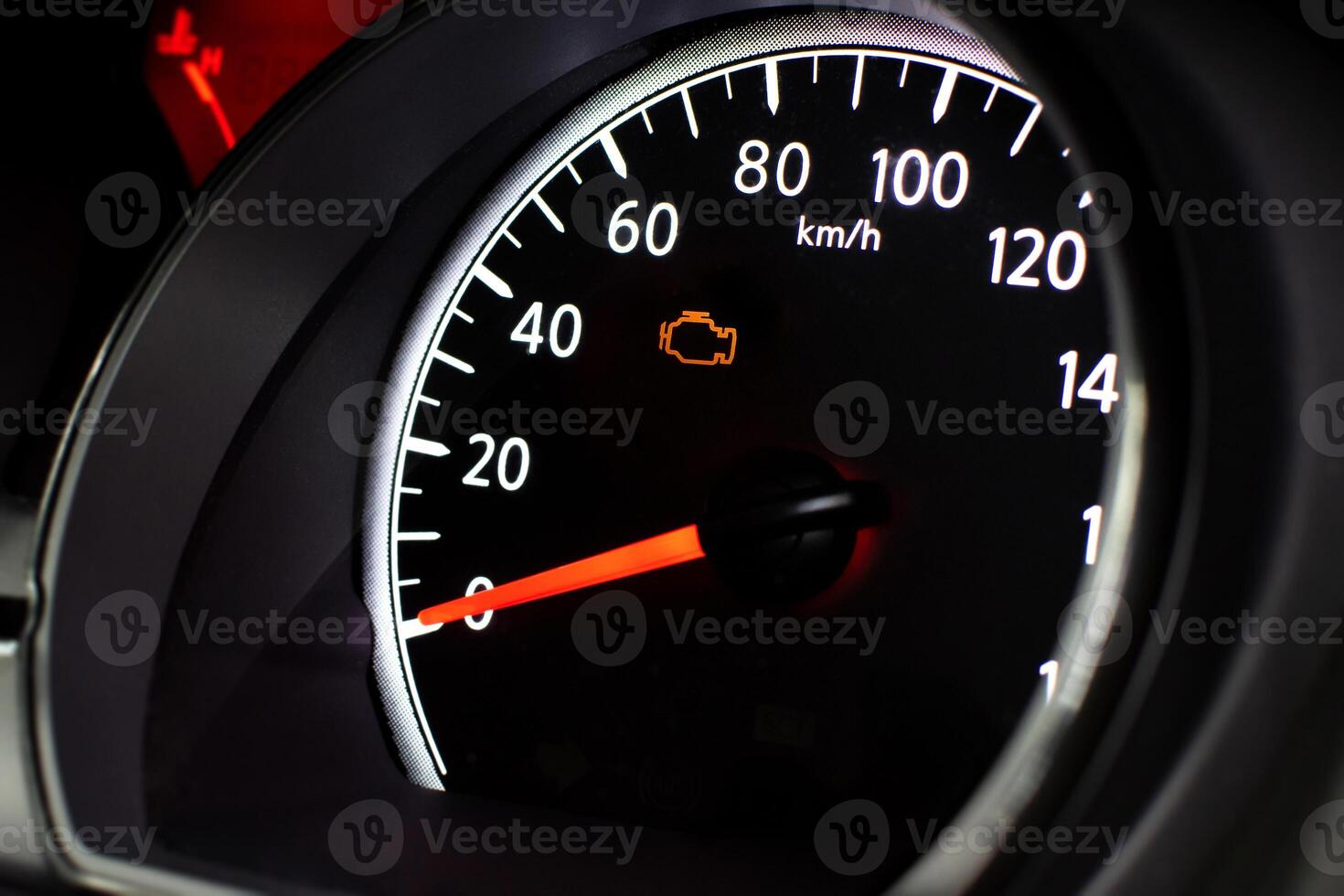 Check Engine Light Close Up, A car speedometer with an illuminated orange check engine light photo