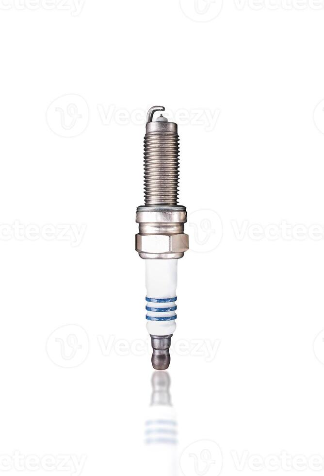 Iridium Spark Plug, A single, new iridium spark plug with a white ceramic insulator and metal threading, isolated on white background include clipping path. photo